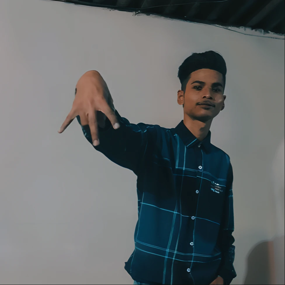 there is a man standing in front of a white wall pointing at something, shooting pose, cool pose, with index finger, low quality video, very very low quality picture, very cool pose, pointing at the camera, distorted pose, t pose, really cool pose, very artistic pose, with a cool pose, in an action pose, action pose