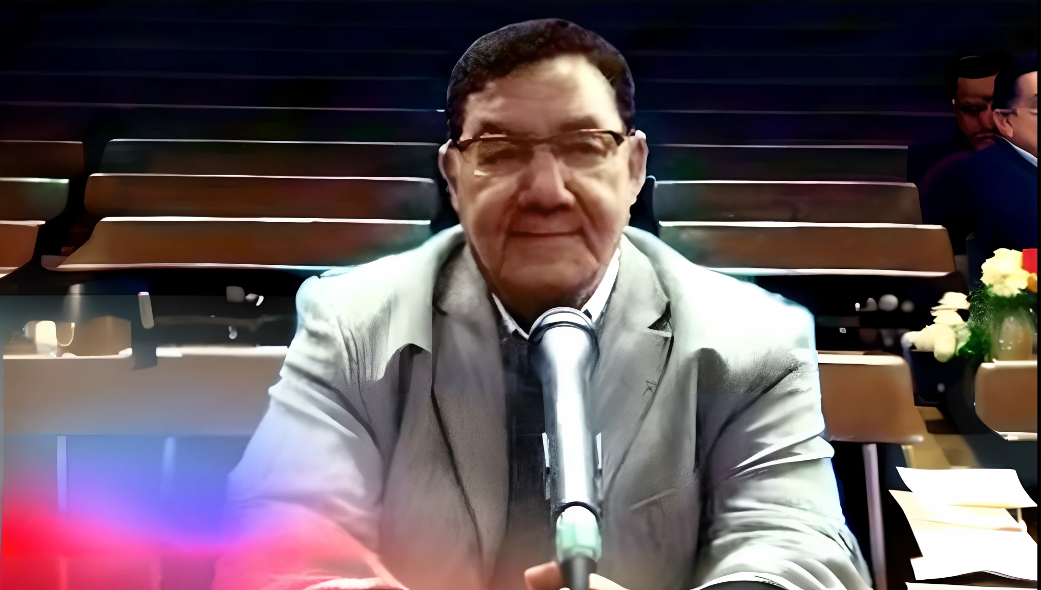 There's a man sitting at a table with a microphone, Herald Ortega, Carlos Ortega Elizalde, Salustiano Garcia Cruz, juan jose serrano, Ahmad Merheb, Pedro Correa., Ignacio Fernandez Rios, Amr Elshamy, Ignacio Fernandez Rios, mohamed chahin, Ricardo Milos, Carlos Huante