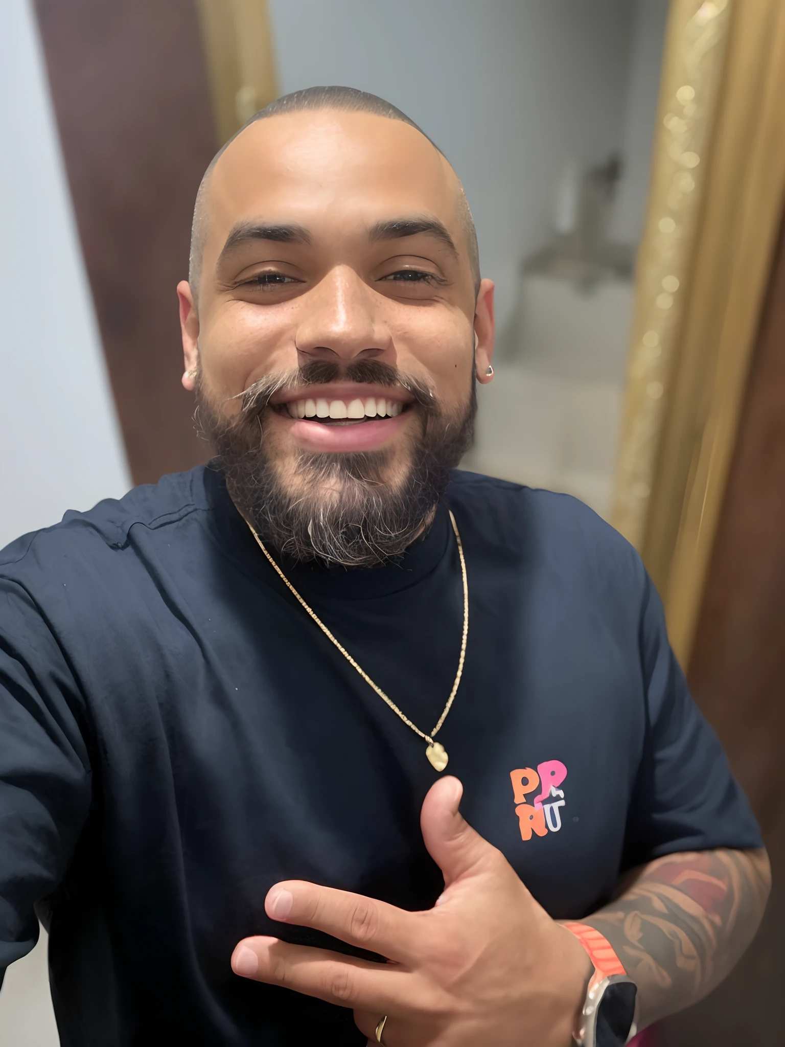There's a man who's smiling and making a funny face, He's got tattoos on his arms, he's got a beard
