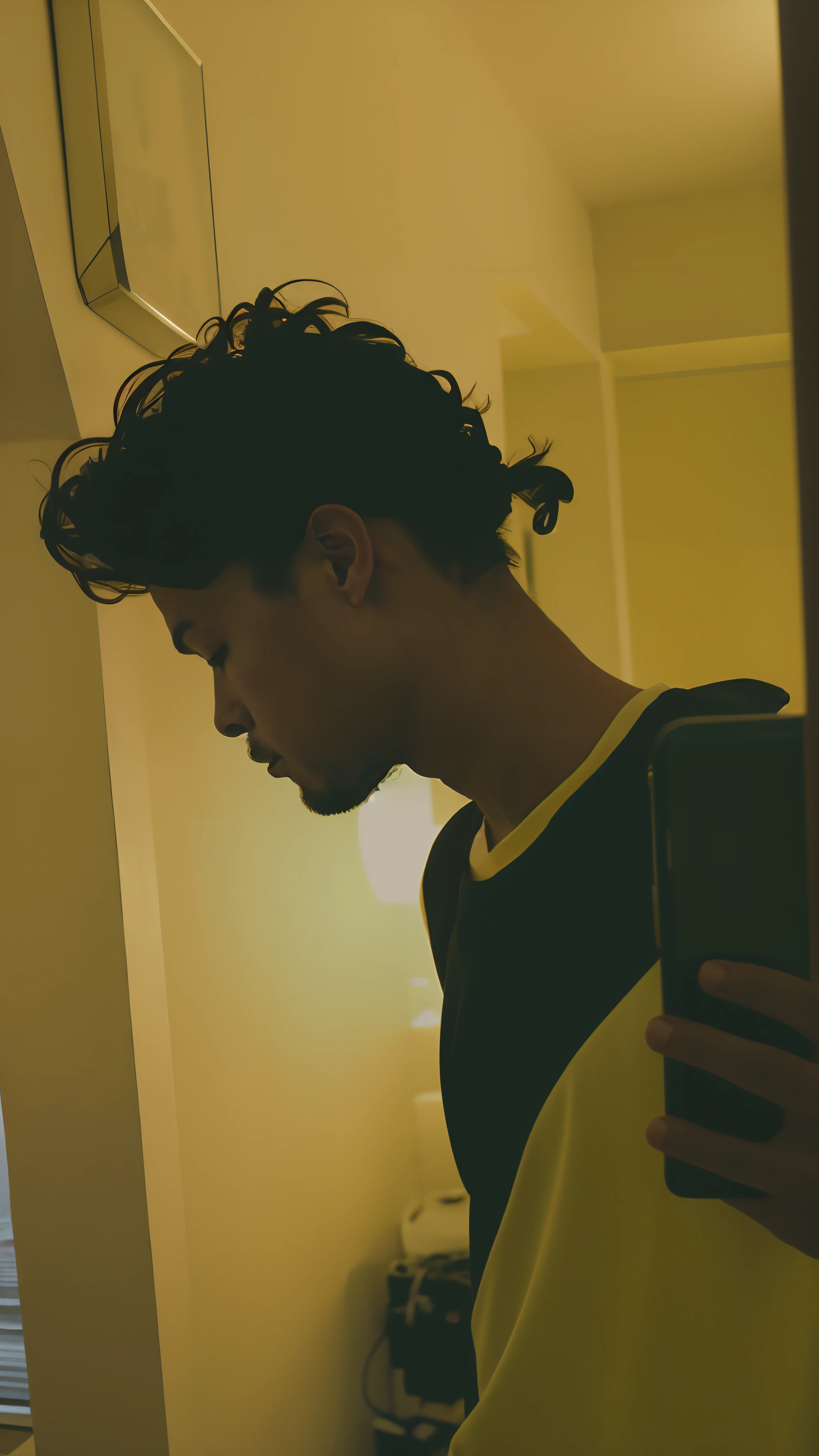 there is a man standing in a hallway looking at his cell phone, still from a music video, lofi portrait at a window, portrait shot 8 k, music video, portrait shot, still from a live action movie, potrait, still from the movie, profile shot, still from a movie, shot from cinematic, mid shot portrait, in style of kar wai wong