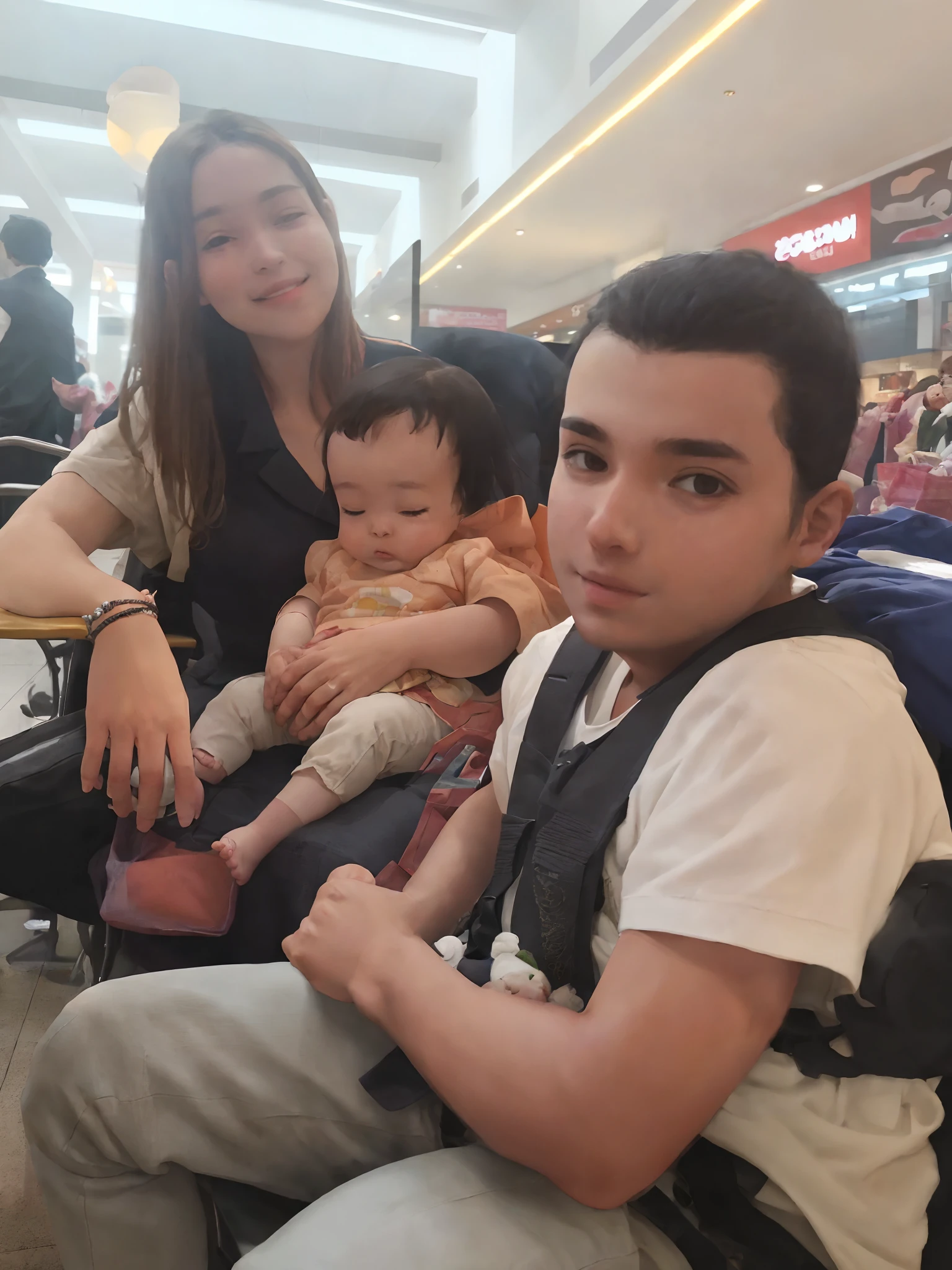 There are two people sitting in a chair with a baby, imagem de qualidade muito baixa, Directed by: Nandor Soldier, em um shopping, em um shopping, with a kid, babies in her lap, aparecer em um shopping center, Upload de alta qualidade, mateus 9 5, foto de baixa qualidade, 1614572159