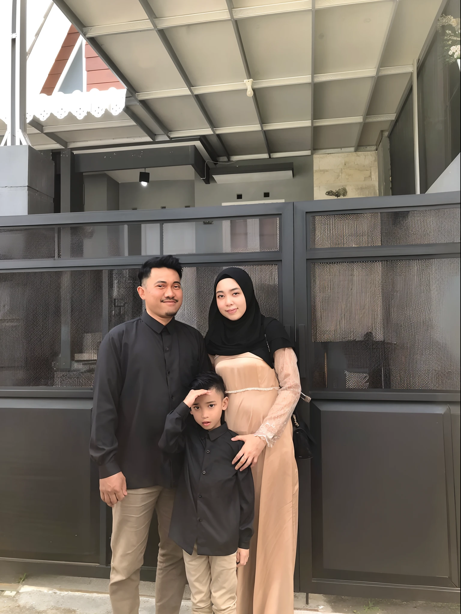 araffe family posing for a picture in front of a building, happy family, husband wife and son, barong family, an indonesian family portrait, old picture, captured on iphone, instagram post, family portrait, full protrait, by Basuki Abdullah, ismail, facebook post, barong family member, shot with iphone 1 0, taken with sony alpha 9