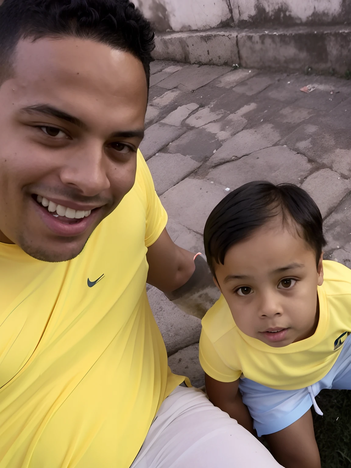 there is a man and a child that are sitting on the ground, ronaldo nazario fenomeno, ronaldo nazario, caio santos, ronaldo luis nazario da lima, with a kid, edu souza, dan dos santos, ronaldo luis nazario de lima, daddy, david rios ferreira, icaro carvalho, joseph moncada, luis melo