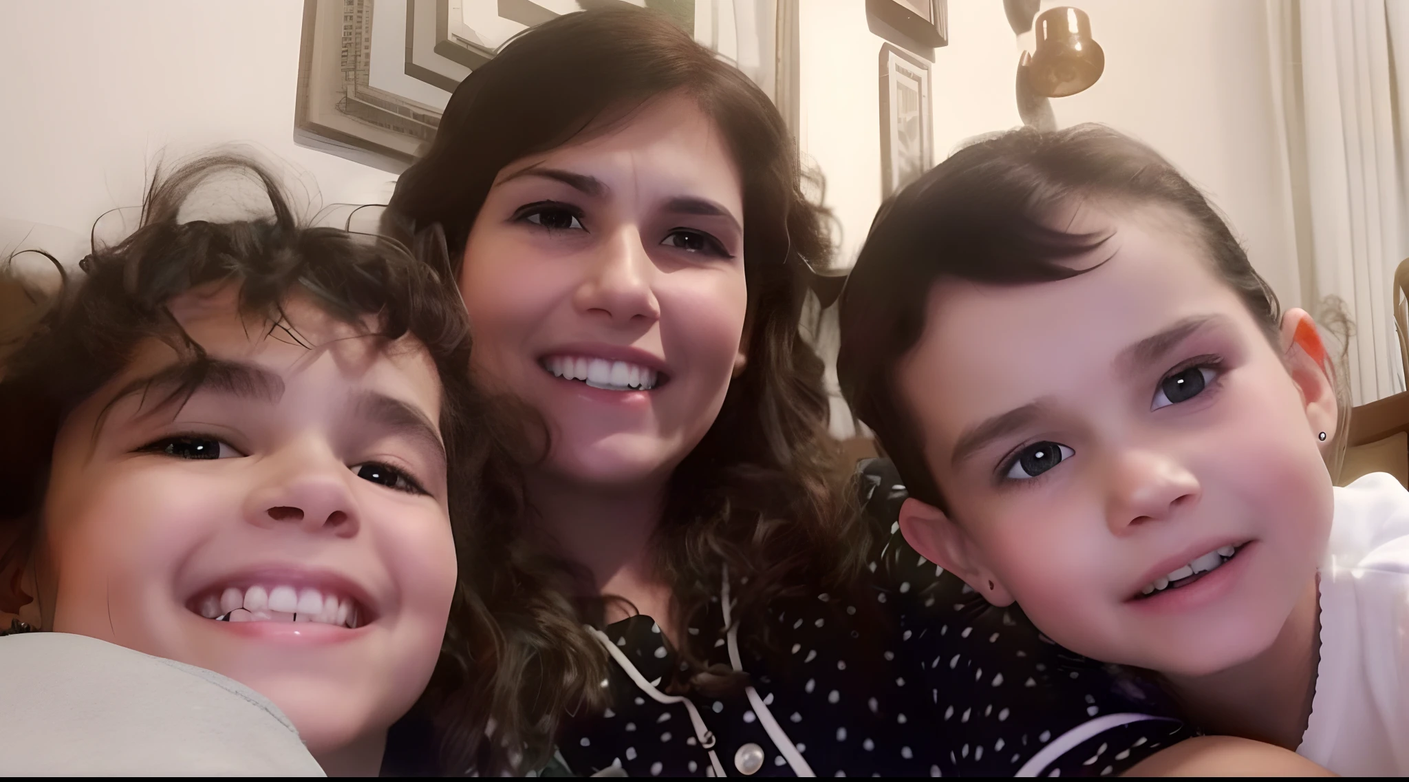A mother with her two daughters smiling sitting on a couch watching a cartoon.