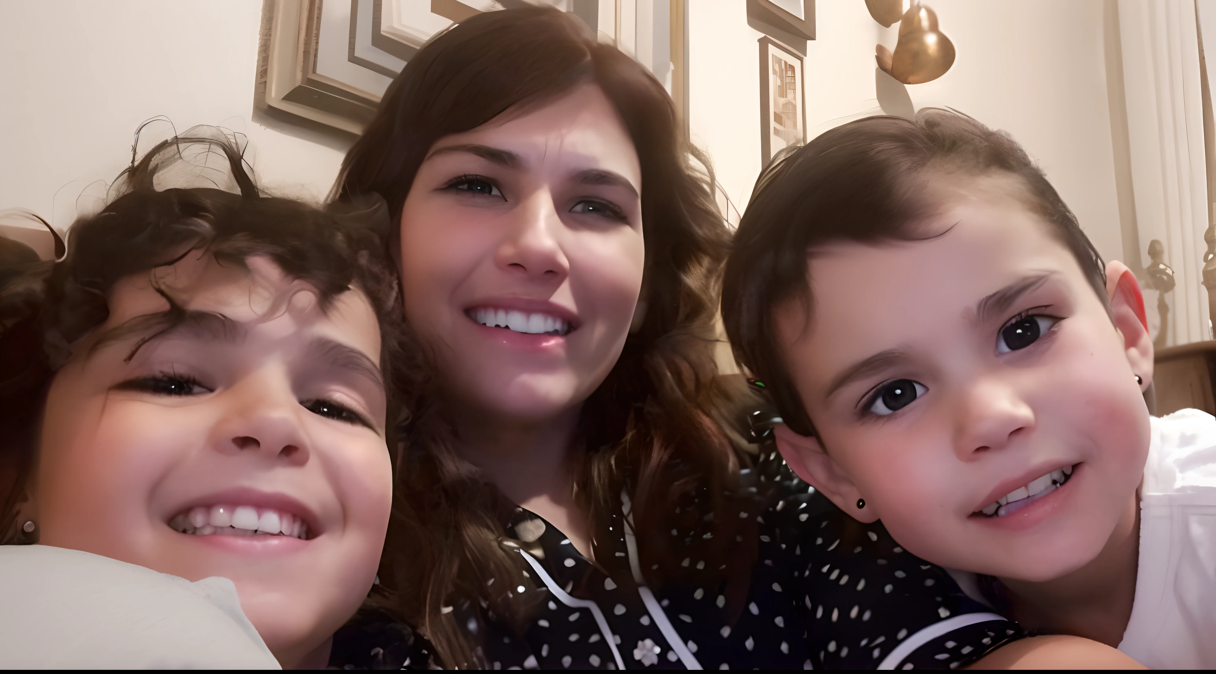 A mother with her two daughters smiling sitting on a couch watching a cartoon.