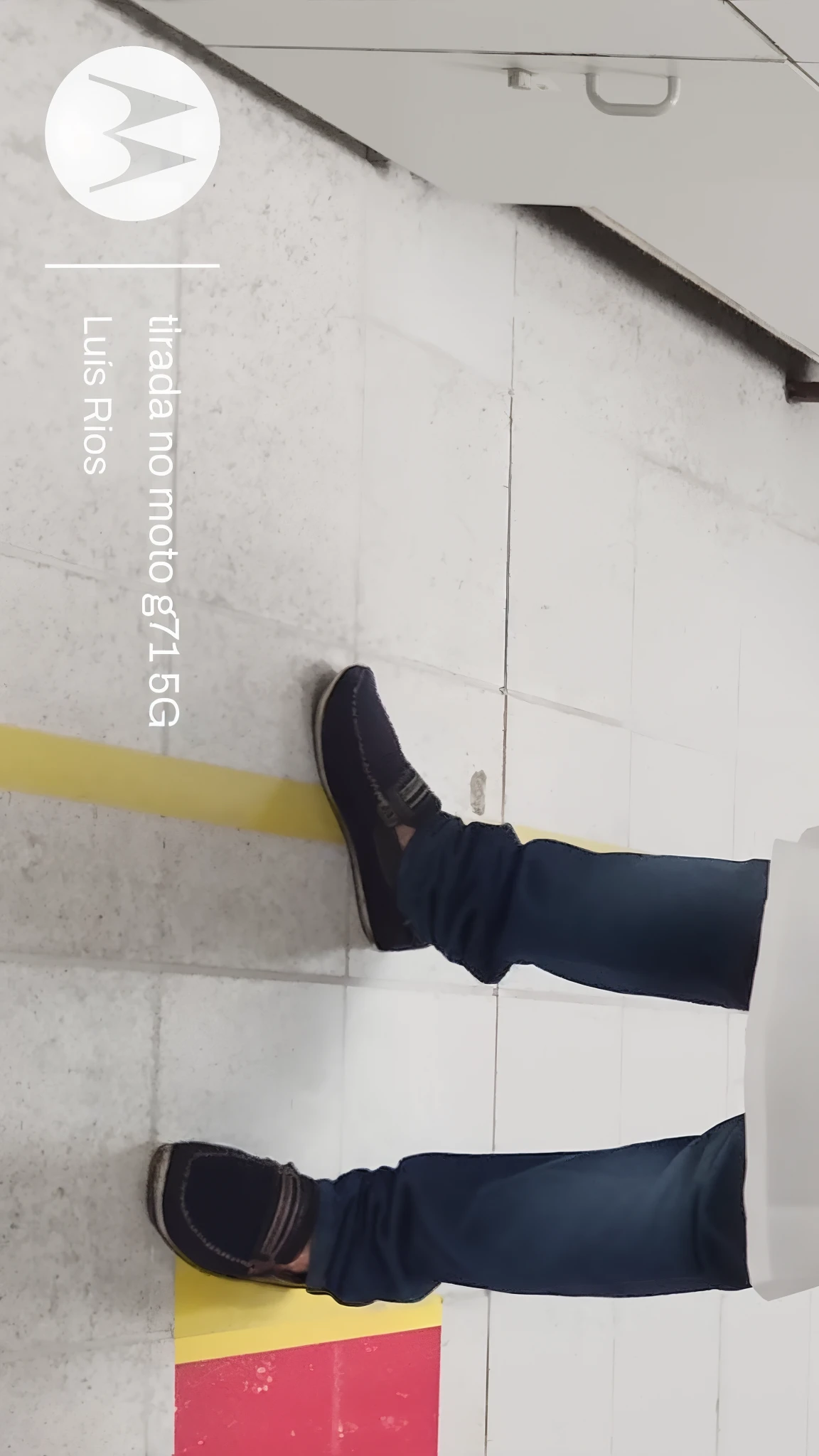 There's a man standing in a long hallway with a red object, stood in a lab, em um centro de pesquisa, foxish guy in a lab coat, stood inside a futuristic lab, in a lab, in lab, lab in the background, lab in the background, in lab, inside a science facility, scientist, in an underground laboratory