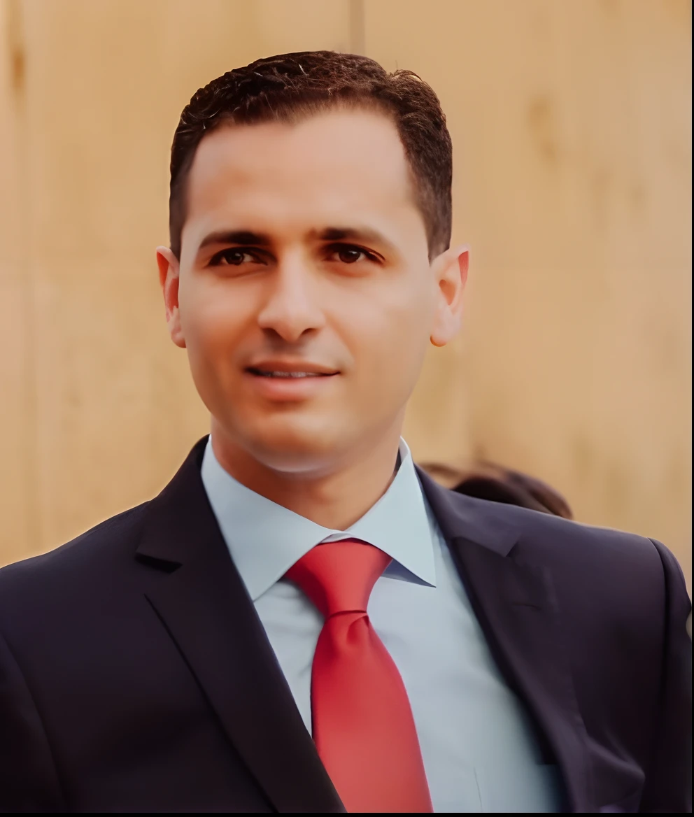 Man in red suit and tie standing in front of a wall, Amr Elshamy, Mohamed Chahin, edin durmisevic, Riabovitchev, Ahmad Merheb, Raphael Personnaz, david rios ferreira, Stefan Kostic, ignacio fernandez rios, Cristiano Orrillo, Sam Nassour, andrew krivulya