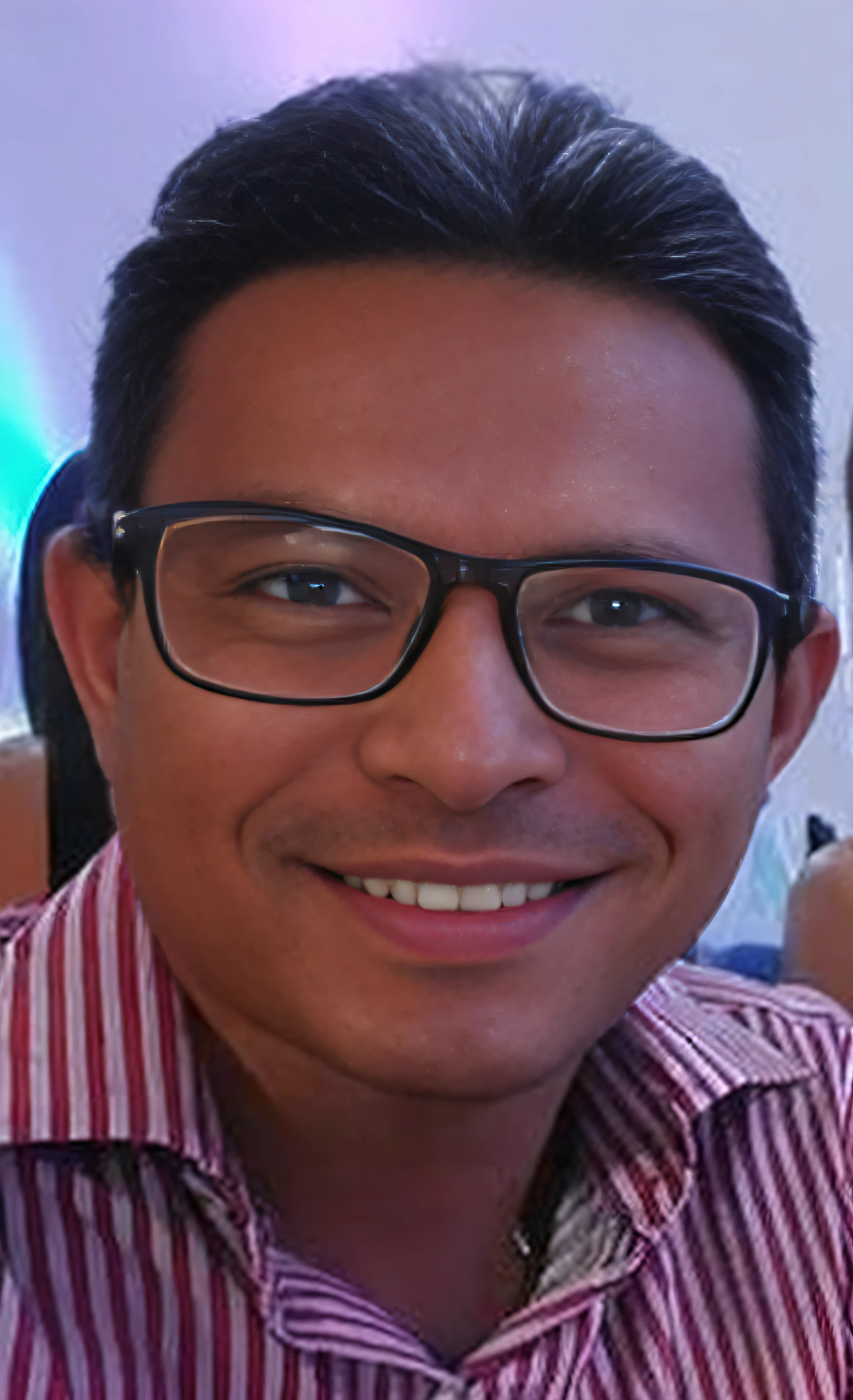 smiling man in glasses and a striped shirt sitting at a table, david rios ferreira, andres rios, caio santos, edu souza, joseph moncada, victor maristane, icaro carvalho, jose miguel roman frances, christian orrillo, carmelo blandino, mohamed chahin, henry ascensio, zigor samaniego, danilo torres