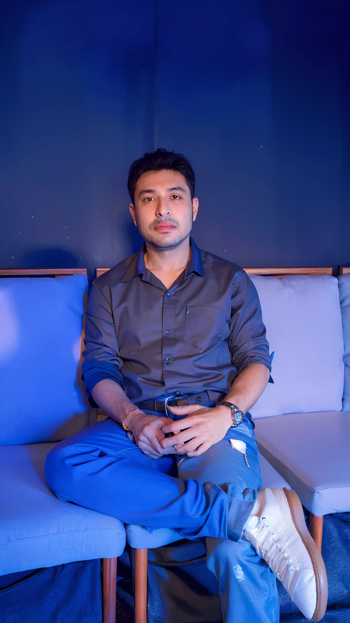 There's a man sitting on a couch with his legs crossed, Mohamed Chahin, Emad Mostaque, Ahmad Merheb, Amr Elshamy, Farid Ghanbari, Condutor de Ene, Sam Nassour, Joel Torres, José Moncada, daniel mirante, Riyahd Cassiem, Sayem Reza, Khyzyl Saleem