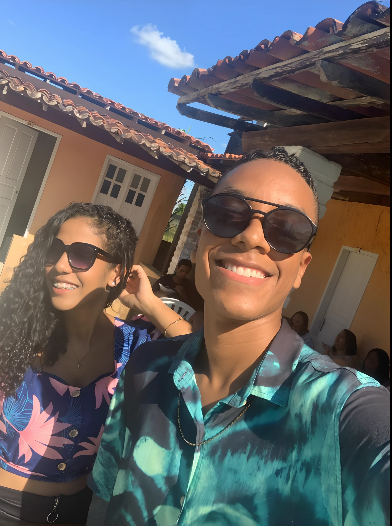 Smiling couple taking selfie in front of a house with blue sky, Directed by: Nandor Soldier, Directed by: Willian Murai, both smiling for the camera, Ashteroth, Directed by: Emerson Silva, com pele parda, Directed by: CeFerí Olivé, vacation photo, suave em _ O pano de fundo, Directed by: Herbert MacNair, Directed by: Andrée Ruellan