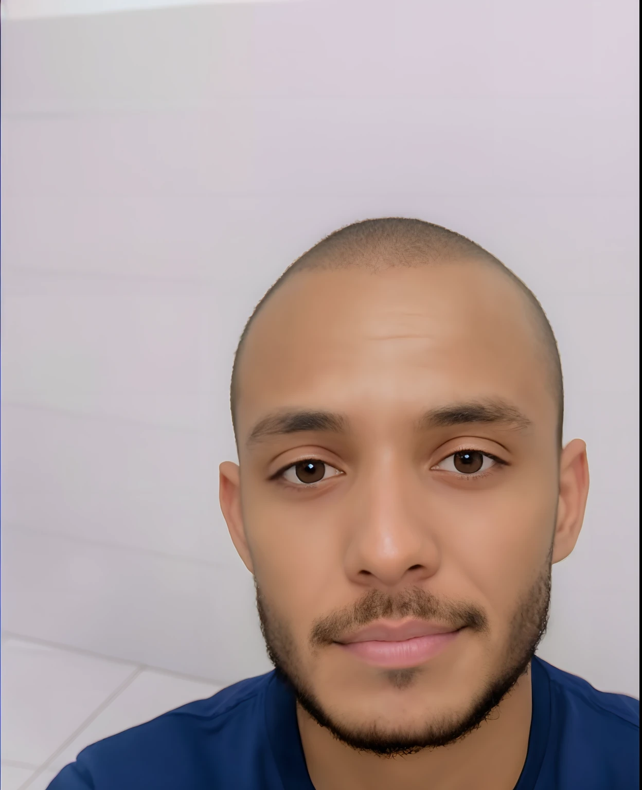 30-year-old man, dark skin, brown eyes, with a little beard and short hair, friendly.
