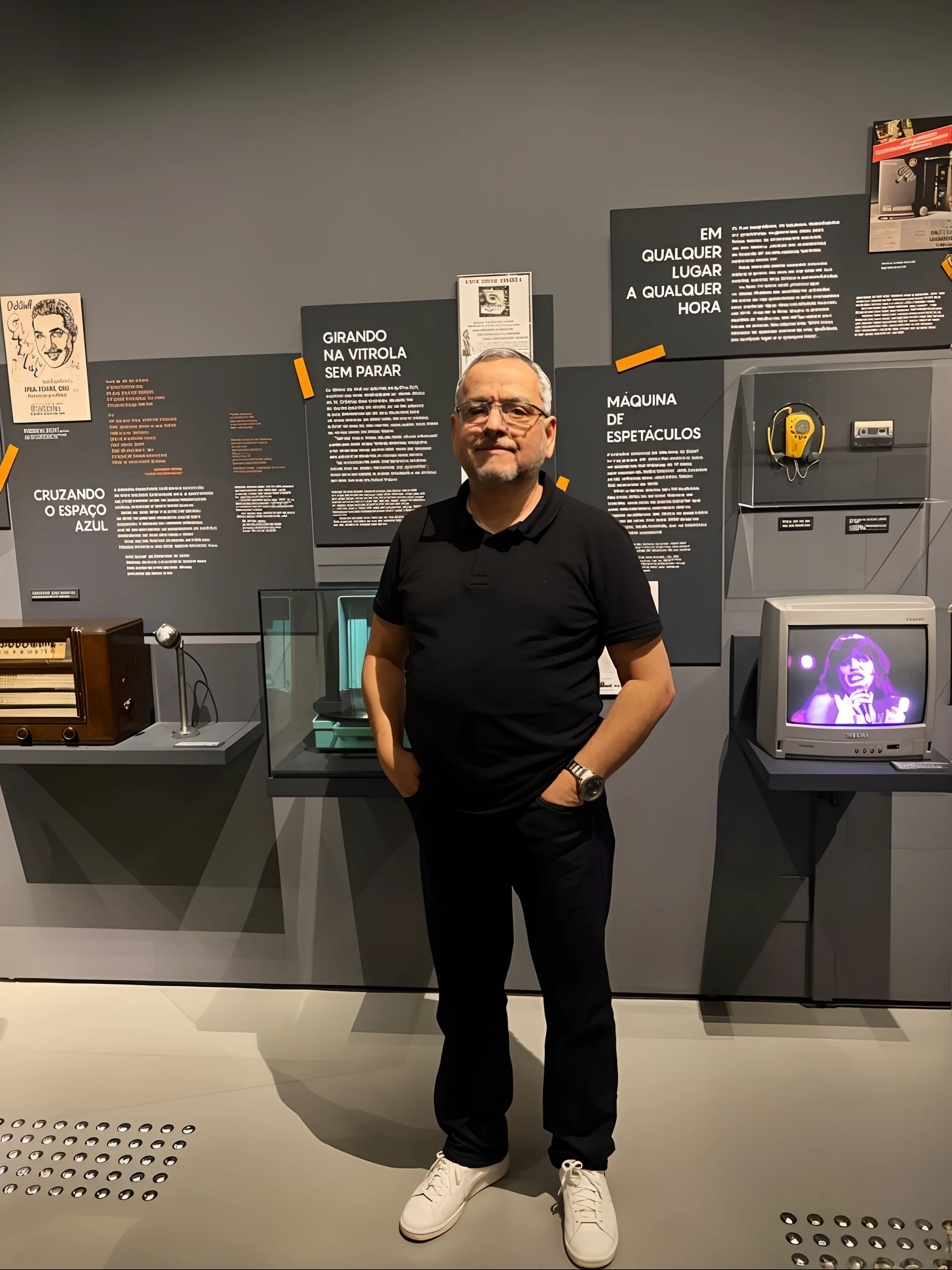 arafed man standing in front of a display of old televisions, Henry Alvim Correa, museum picture, in the museum, gui guimaraes, Ignacio Fernandez Rios, inspired by Antônio Parreiras, in sao paulo, museum curator, by Agustín Fernández