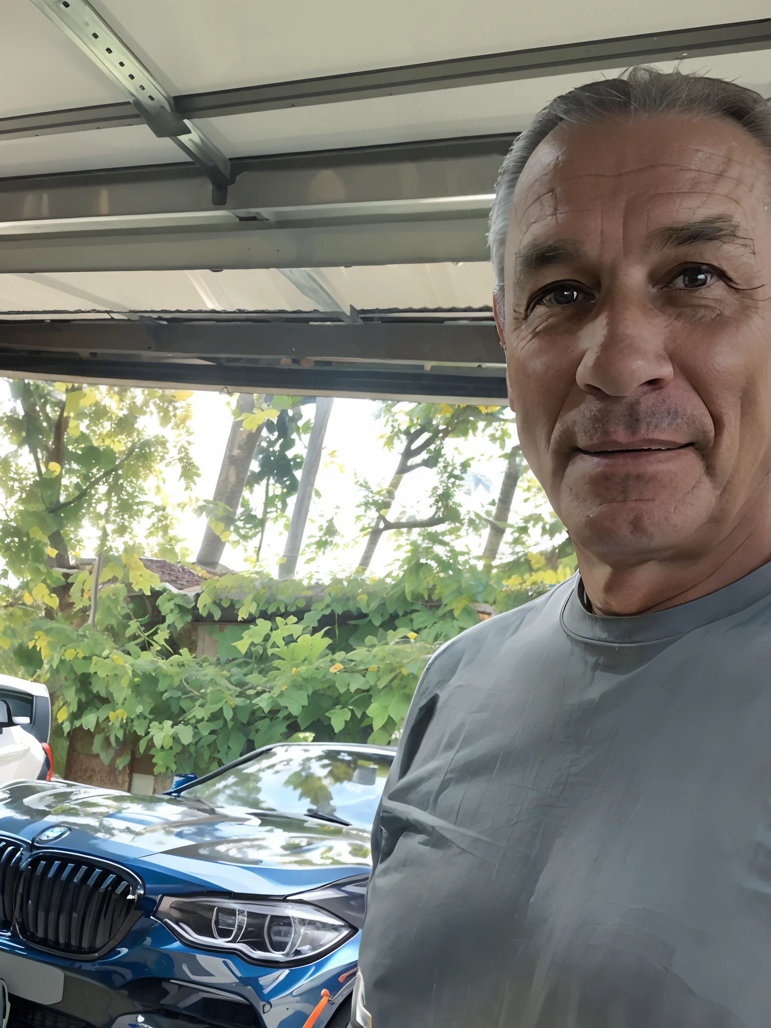 there is a man standing in a garage with a bmw car, standing in his cluttered garage, in front of a garage, he is about 6 0 years old, he is about 60 years old, 8k selfie photograph, he is about 50 years old, he is about 5 0 years old, 45 years old men