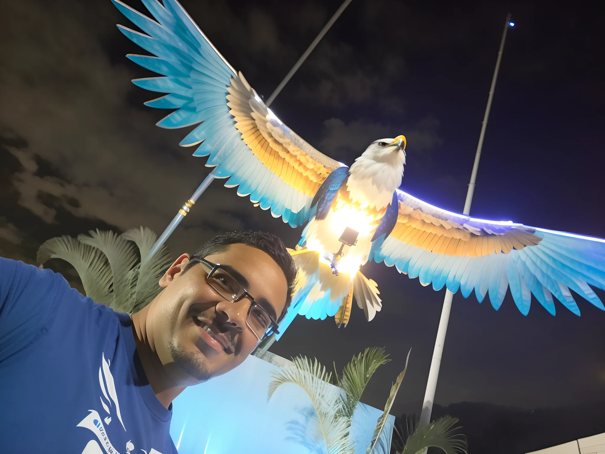 Man in blue shirt standing in front of a bird statue, with a giant robot owl, imagem do avatar, with great birds, com um papagaio grande, flying around the bird, com asas reais, Raziel IRL, photo taken at night, ophanim has bird wings, with the beak of an eagle, with an eagle emblem, david rios ferreira