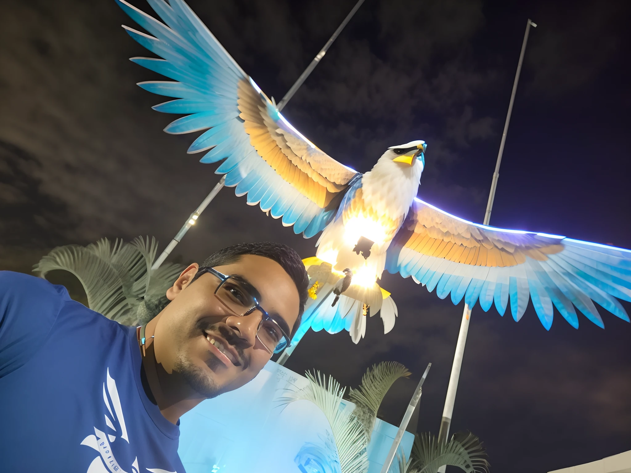 Man in blue shirt standing in front of a bird statue, with a giant robot owl, imagem do avatar, with great birds, com um papagaio grande, flying around the bird, com asas reais, Raziel IRL, photo taken at night, ophanim has bird wings, with the beak of an eagle, with an eagle emblem, david rios ferreira