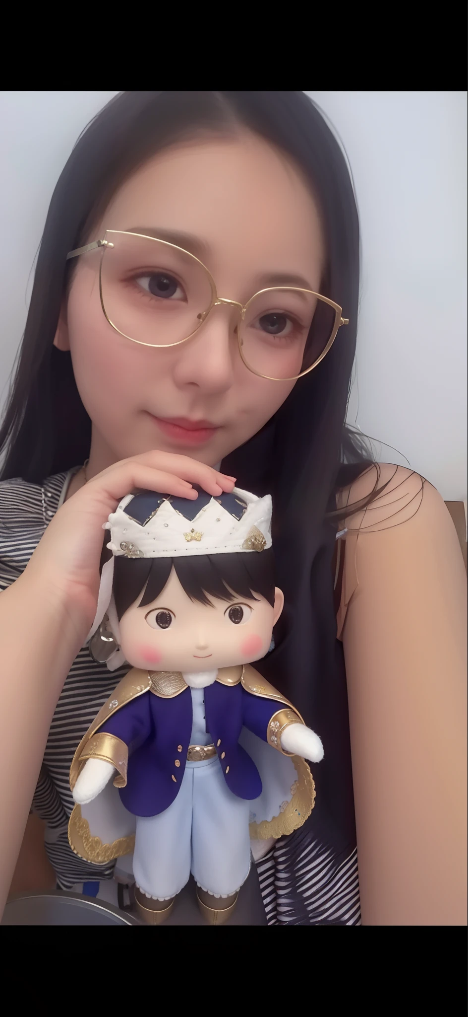Woman holding a felt prince doll in a cute atelier with sewing machine threads and fabrics