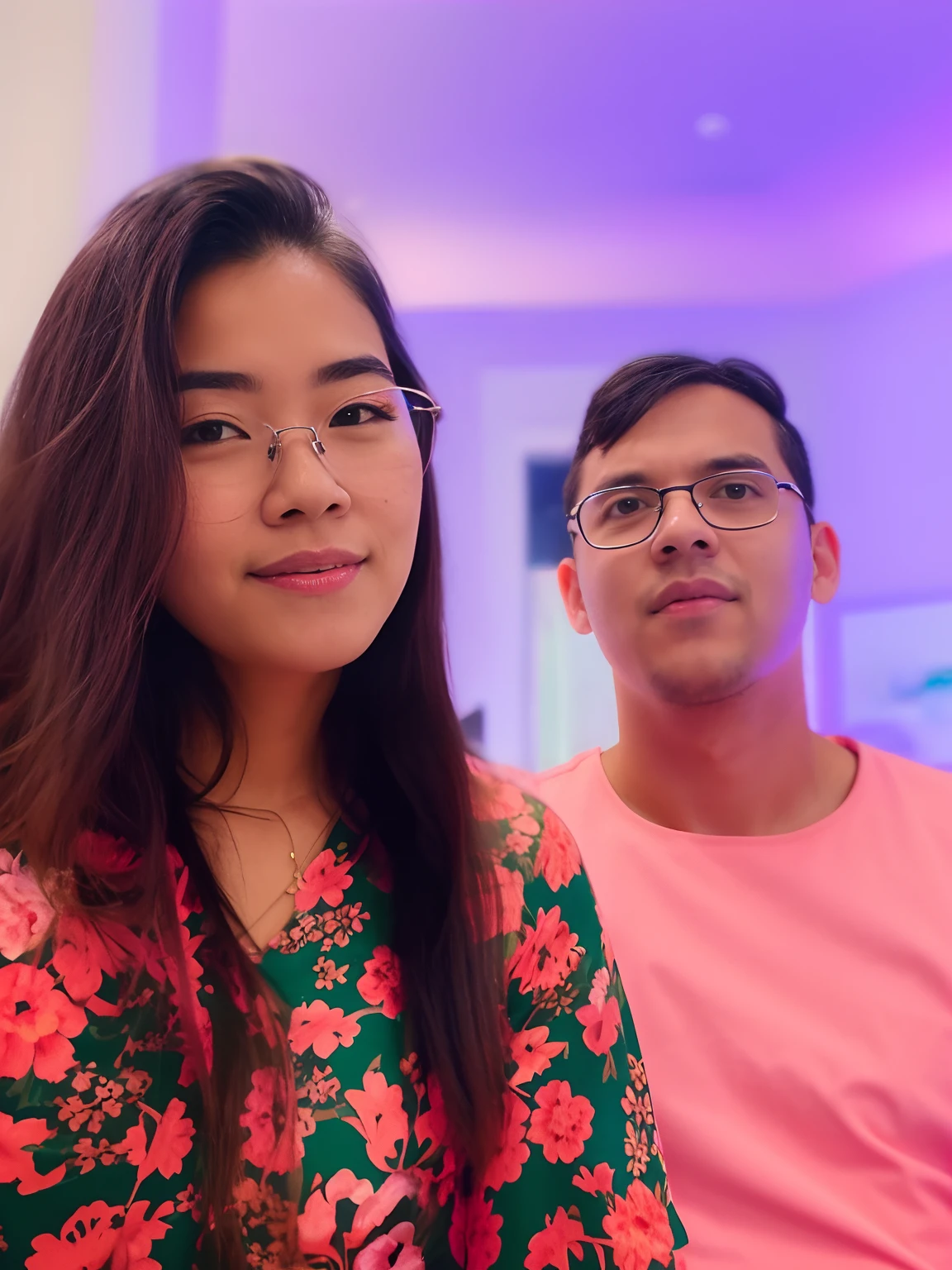 There's two people, she's wearing glasses and a flowery dress, and he's pink shirt