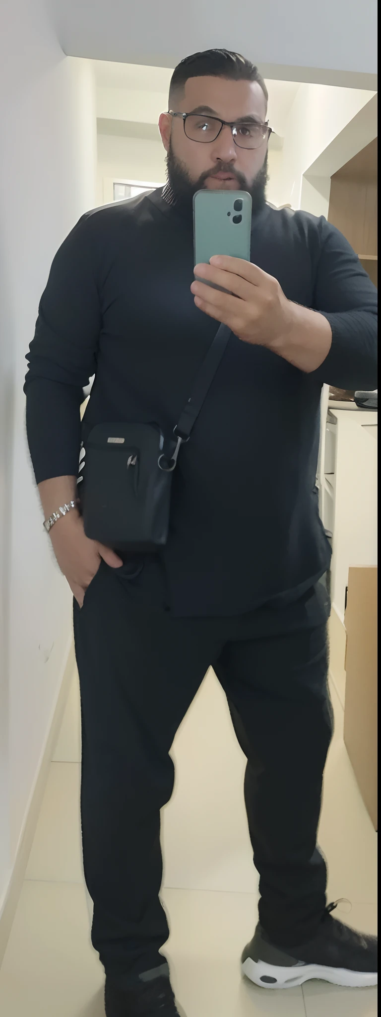 there is a man taking a selfie in a mirror, full body profile camera shot, full body camera shot, full body in camera, vestindo roupas pretas, taken in the early 2020s, vestindo roupas pretas, imagem de qualidade muito baixa, em uniforme preto, imagem de corpo inteiro, foto da roupa, traje: soprar, with his hands in his pockets