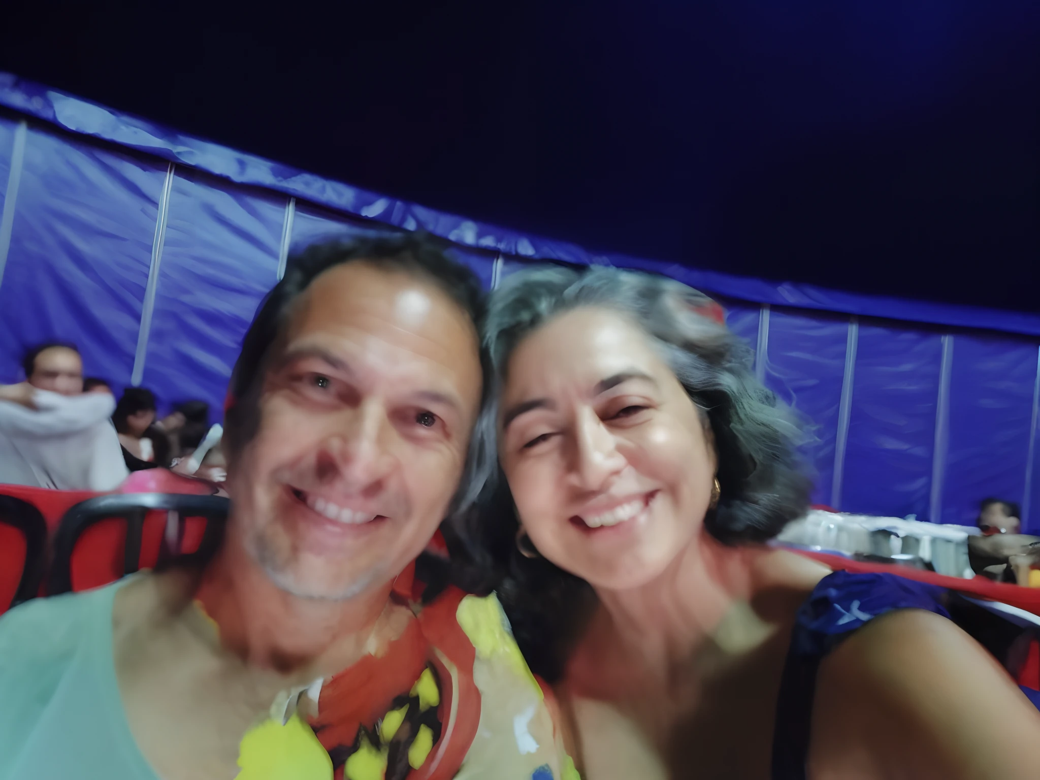 there are two people that are smiling for a picture together, Directed by: Nandor Soldier, imagem de perfil, dentro de uma tenda de circo, divertindo-se, em uma tenda colorida, non blurry, Alex Grey e Romero Ressendi, imagem de qualidade muito baixa, 🌻🎹🎼, Malika Favre, by Amelia Peláez, Noite!