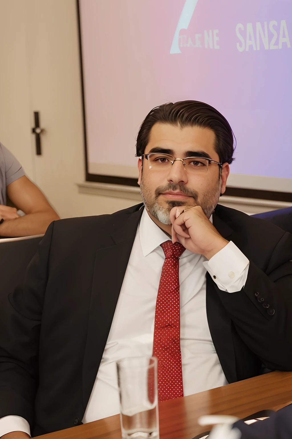 There's a man sitting at a table with a red tie, Elias Chatzoudis, Ahmad Merheb, Eliezer Yudkowsky, Linha Yesilbas, George Doutsiopoulos, Ignacio Rios, ignacio fernandez rios, Eytan Zana, ignacio fernandez rios, edin durmisevic, Emad Mostaque