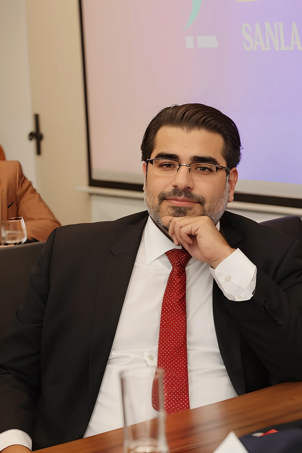 There's a man sitting at a table with a red tie, Elias Chatzoudis, Ahmad Merheb, Eliezer Yudkowsky, Linha Yesilbas, George Doutsiopoulos, Ignacio Rios, ignacio fernandez rios, Eytan Zana, ignacio fernandez rios, edin durmisevic, Emad Mostaque