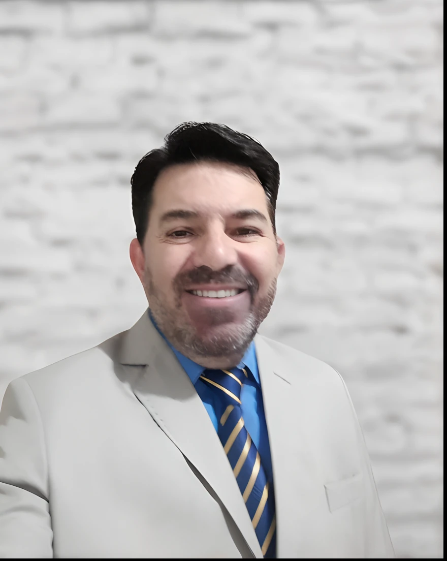 Smiling man in a suit and tie standing in front of a brick wall, david rios ferreira, ignacio fernandez rios, Cristiano Orrillo, Joel Torres, andres rios, ignacio fernandez rios, daniel mirante, danilo torres, victor maristane, luiz escanuela, icaro carvalho, Carregado, Miguel Vicente