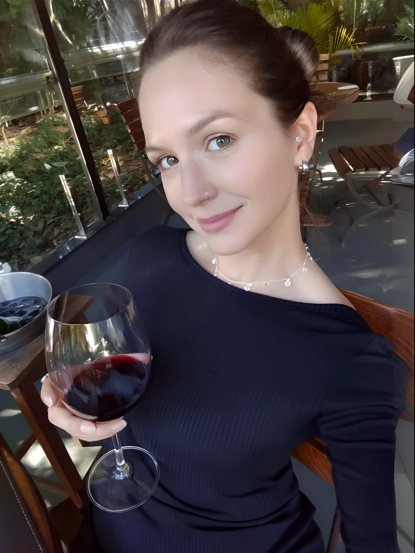 Nicole Kidman with short hair holding a glass of wine completely naked and smiling