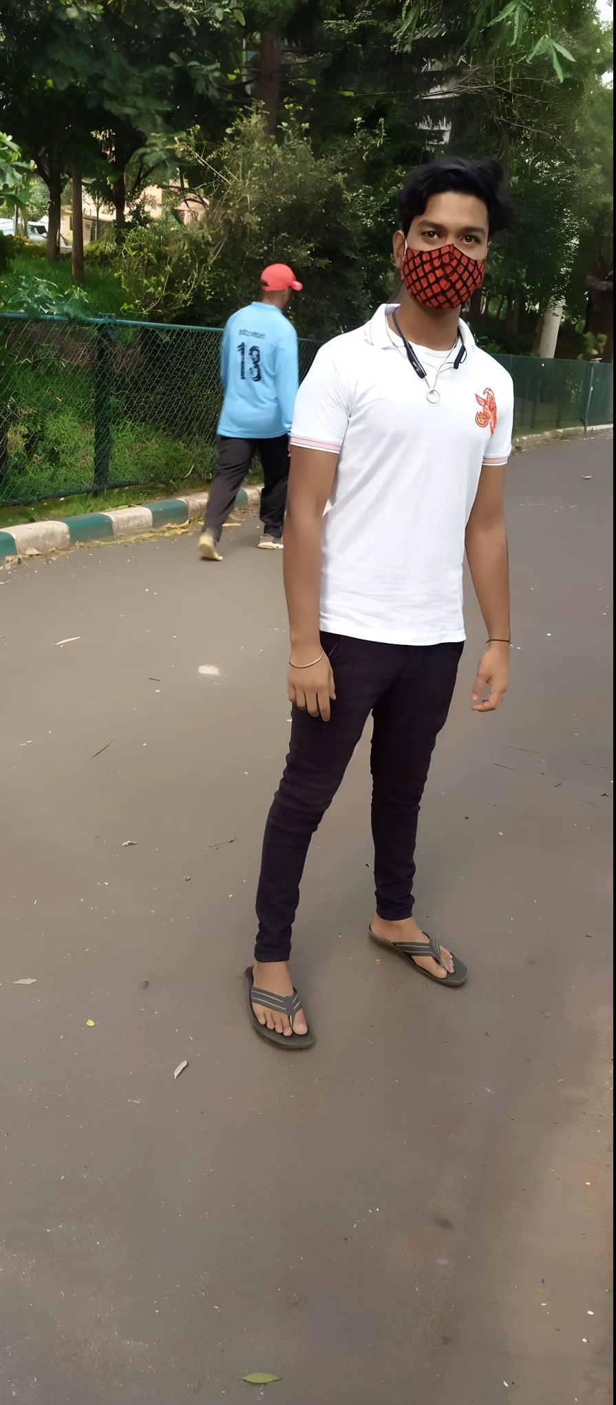 there is a man standing on a road wearing a face mask, full body picture, standing in road, distant full body shot, distant full body view, full body photogenic shot, casual pose, standing in street, full body in camera, full body pictures, frontal pose, with a cool pose, candid photo, around 1 9 , indian, with lovely look