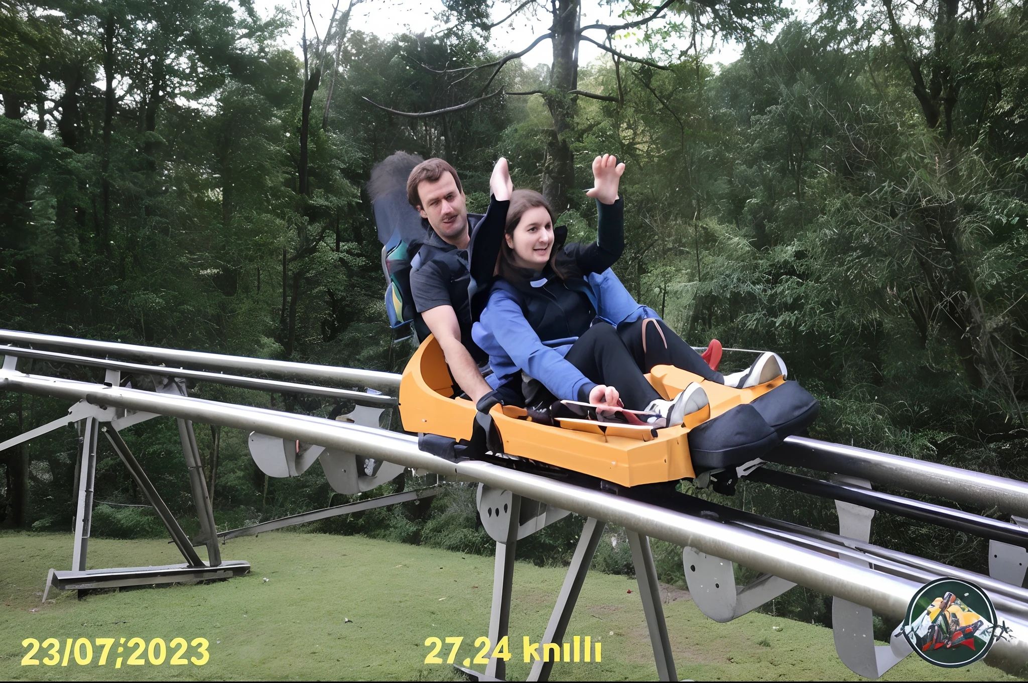 father and daughter quickly descending the sled in the middle of a forest in lawn rs brasil at alphen park