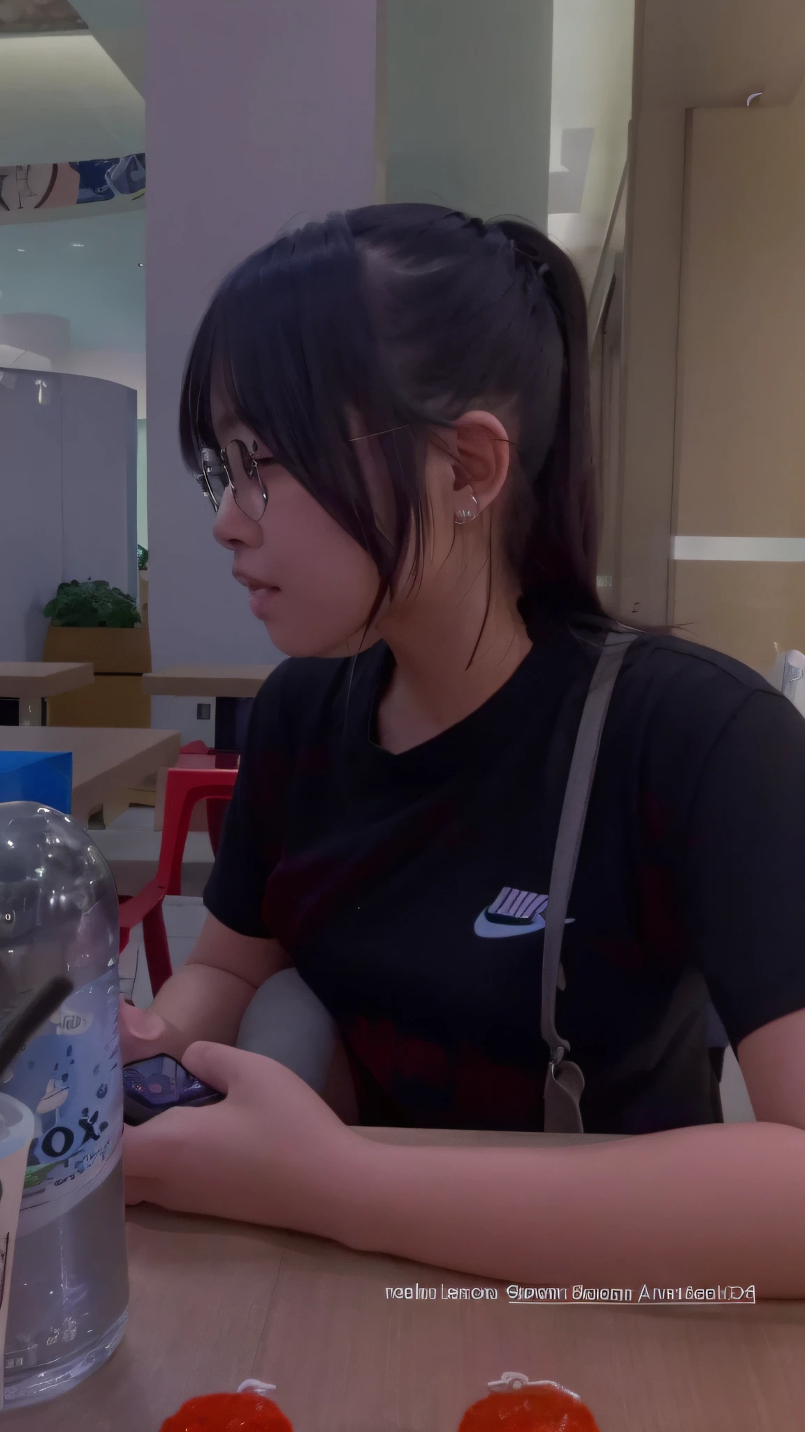 there is a woman sitting at a table with a cell phone, low quality video, low quality footage, 8k 50mm iso 10, checking her phone, very very low quality picture, anime thai girl, very very low quality, taken with sony alpha 9, in a mall, at a mall, she is wearing streetwear, appearing in a shopping mall
