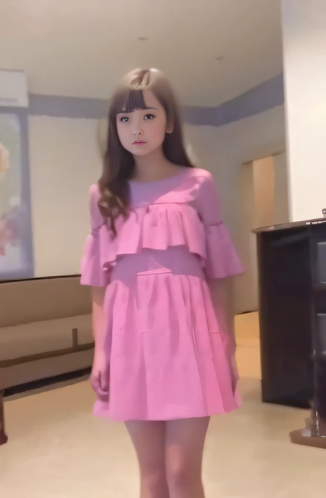 there is a girl in a pink dress,  wearing a dress,