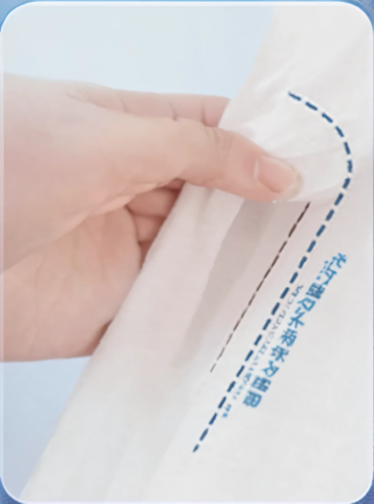 Someone was holding a white cloth，There is a blue line on it, Detailed picture, non-pleated section, seams stitched tightly, knitted mesh material, high detal, extra detail, Bifold hem, High quality details, high detail photo, Visible stitching, correct details, extra detail more details, highly details, closeup detailed