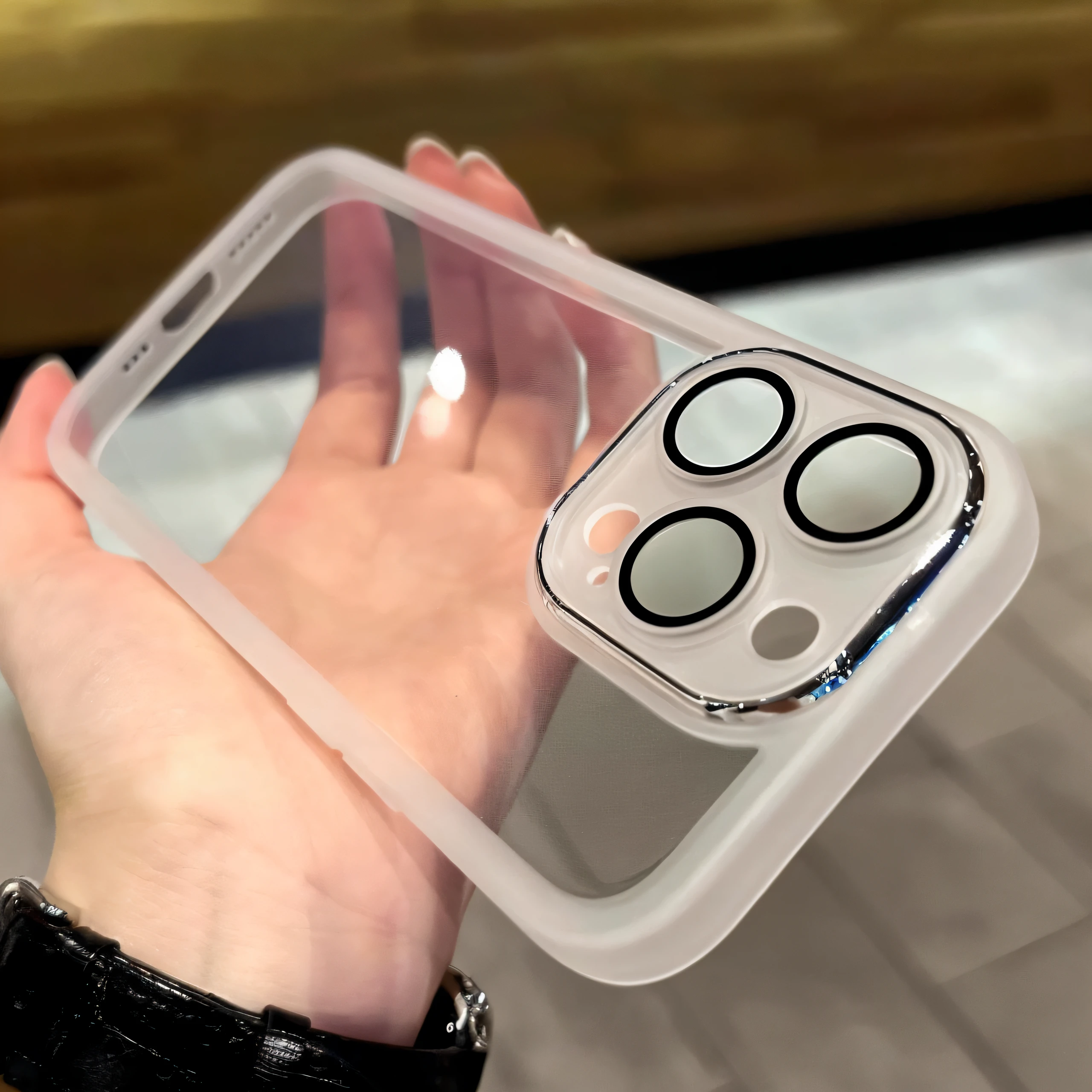 Someone was holding a transparent box，There are four circular buttons on it, iPhone 12, iphone 1 3, iPhone 13, 360*, cell cover style, iPhone 1 3 Pro Max, bottom angles, 👁🌹👾, white outline, 360º, medium close up shot, 🤬 🤮 💕 🎀,   Fully Visible