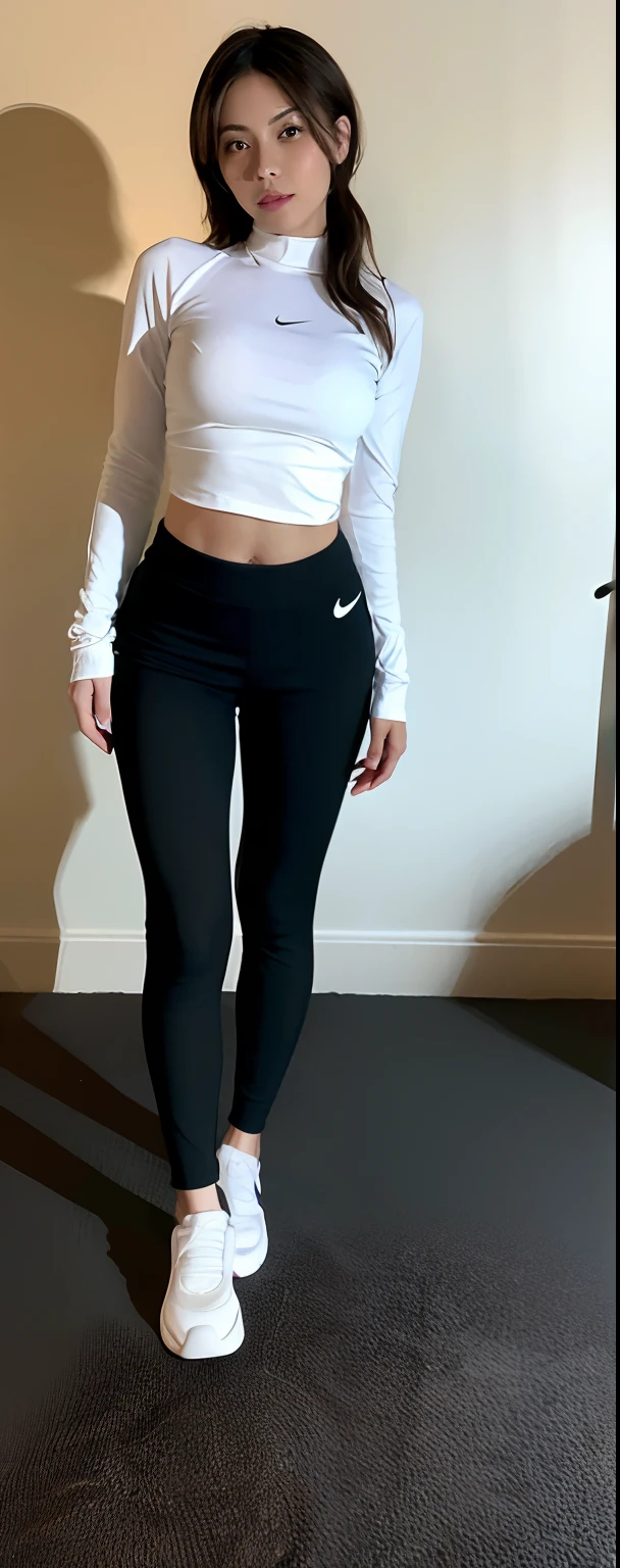 Whole body, thin fit girl standing, wearing white Nike socks, over tight all black pants.