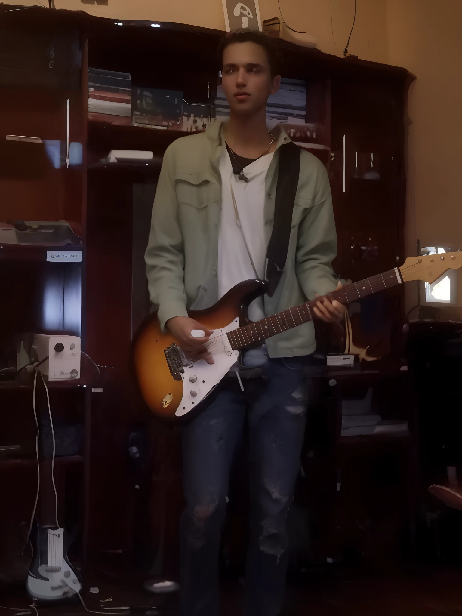there is a man that is playing a guitar in a room, rocking out, jamming to music, solo de guitarra, he is a rockstar, playing the guitar, em torno de 1 9 anos, Guitarra, holding a guitar, tiro de corpo inteiro!!, tocando guitarra, holding Electric Guitar, holding electric guitars, playing electric guitar, holding an electric guitar, guitarrista