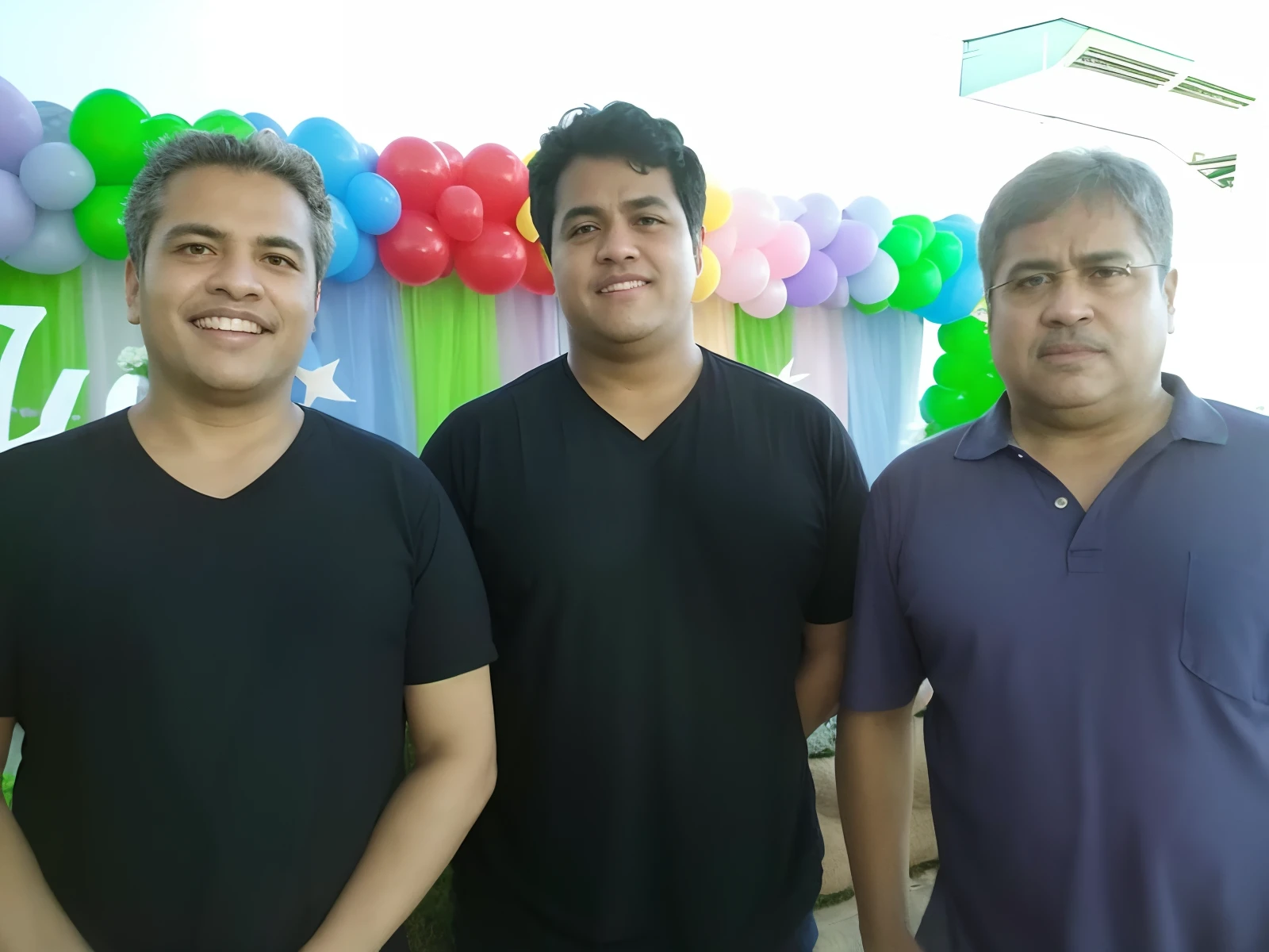 Three men standing in front of a colorful balloon arch, edu souza, Directed by: Willian Murai, david rios ferreira, Paulo Pepera Pablo Roldan, Beto Val, Directed by: Emerson Silva, Directed by: Fernando Gerassi, icaro carvalho, por Veno Pilon, postprocessed), Directed by: Samuel Silva, Directed by: Leo Valledor, Directed by: Robert Combas, In Sao Paulo