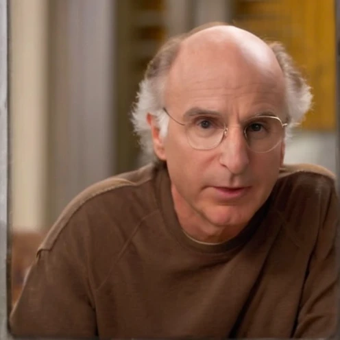 Larry David, the character from “Curb Your Enthusiasm,” mirrors his real-life counterpart with a casual, often disheveled appearance, typically seen in khaki pants, a loose-fitting shirt, and sneakers. He is balding, with a rim of curly hair, and he carries a bemused expression that often shifts into one of exasperation or incredulity,Curb Your Enthusiasm,Larry David, the character from “Curb Your Enthusiasm,” mirrors his real-life counterpart with a casual, often disheveled appearance, typically seen in khaki pants, a loose-fitting shirt, and sneakers. He is balding, with a rim of curly hair, and he carries a bemused expression that often shifts into one of exasperation or incredulity,close up, face