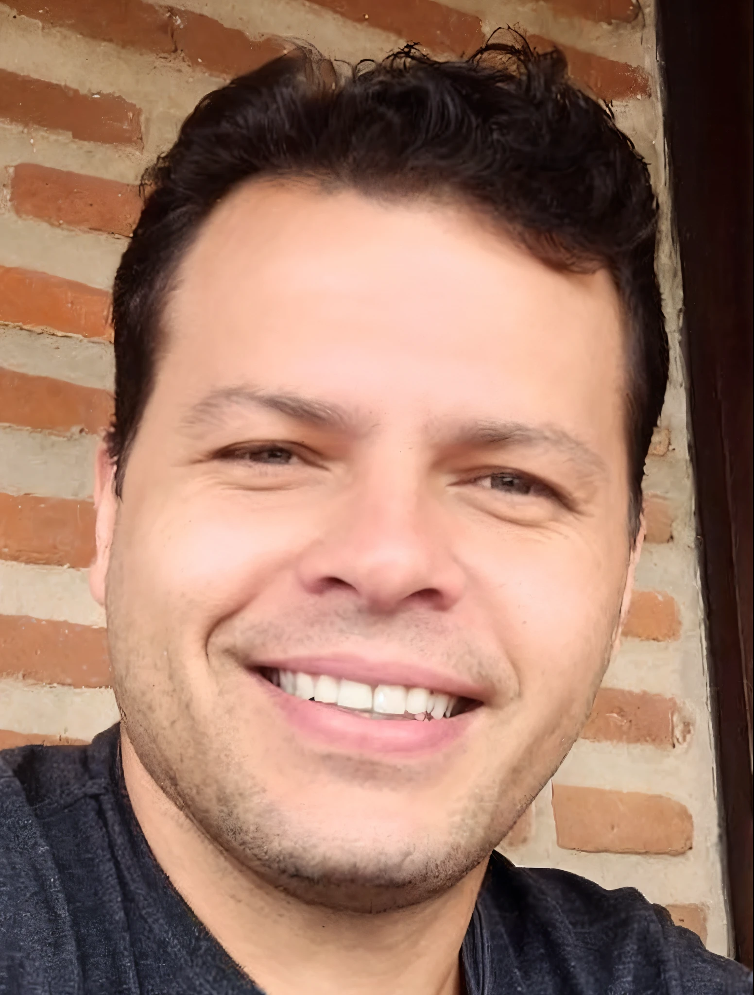 smiling man with a black shirt and a gray shirt and a brick wall, david rios ferreira, avatar image, profile picture, icaro carvalho, by Luis Miranda, by Felipe Seade, headshot profile picture, profile image, edu souza, by Nándor Katona, caio santos, dan dos santos, in sao paulo, gui guimaraes