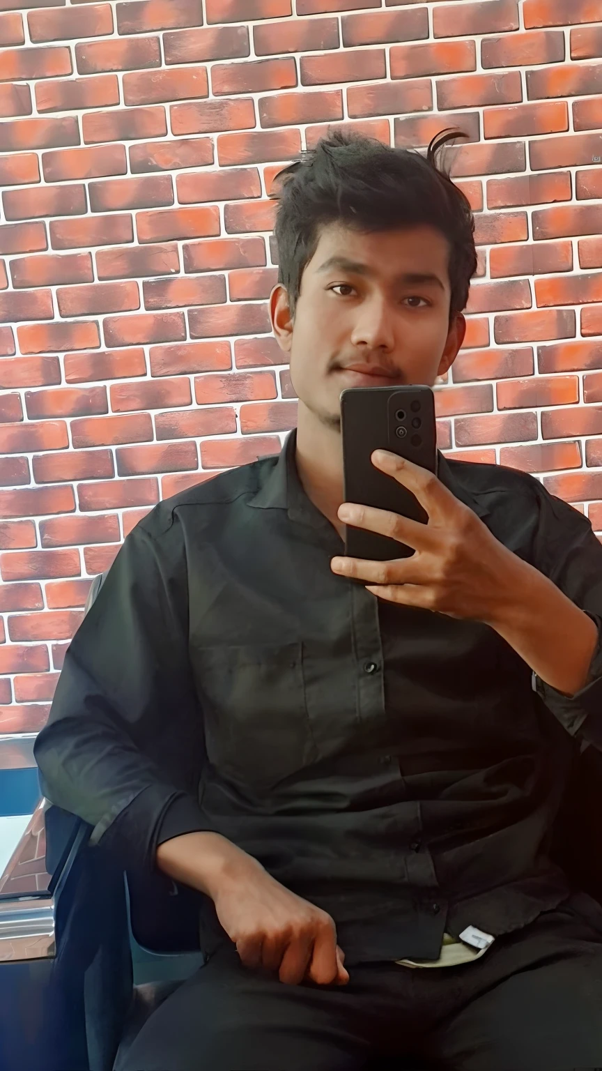 there is a man sitting in a chair taking a selfie, around 1 9 years old, khyzyl saleem, with long hair, ash thorp khyzyl saleem, uploaded, taken in the early 2020s, with accurate face, 2 7 years old, candid picture, with lovely look, with black hair, with black