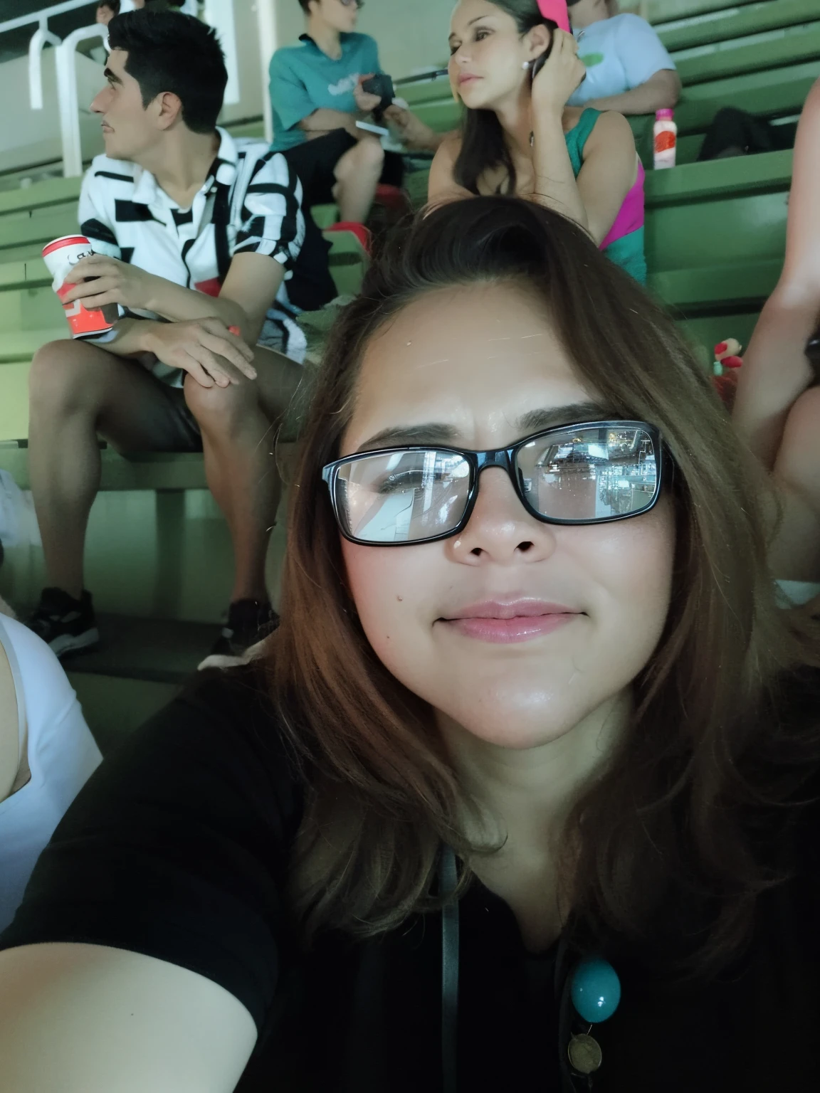 there is a woman with glasses sitting in the stands, 3 0 anos mulher, Alanis Guillen, Lorena Avarez, Mulheres de 40 anos, non blurry, 3 0 anos de idade mulher, Mulher de 30 anos, muito bobo olhando, olhar orgulhoso, Directed by: Randy Vargas, taken in the late 2010s, non blurry