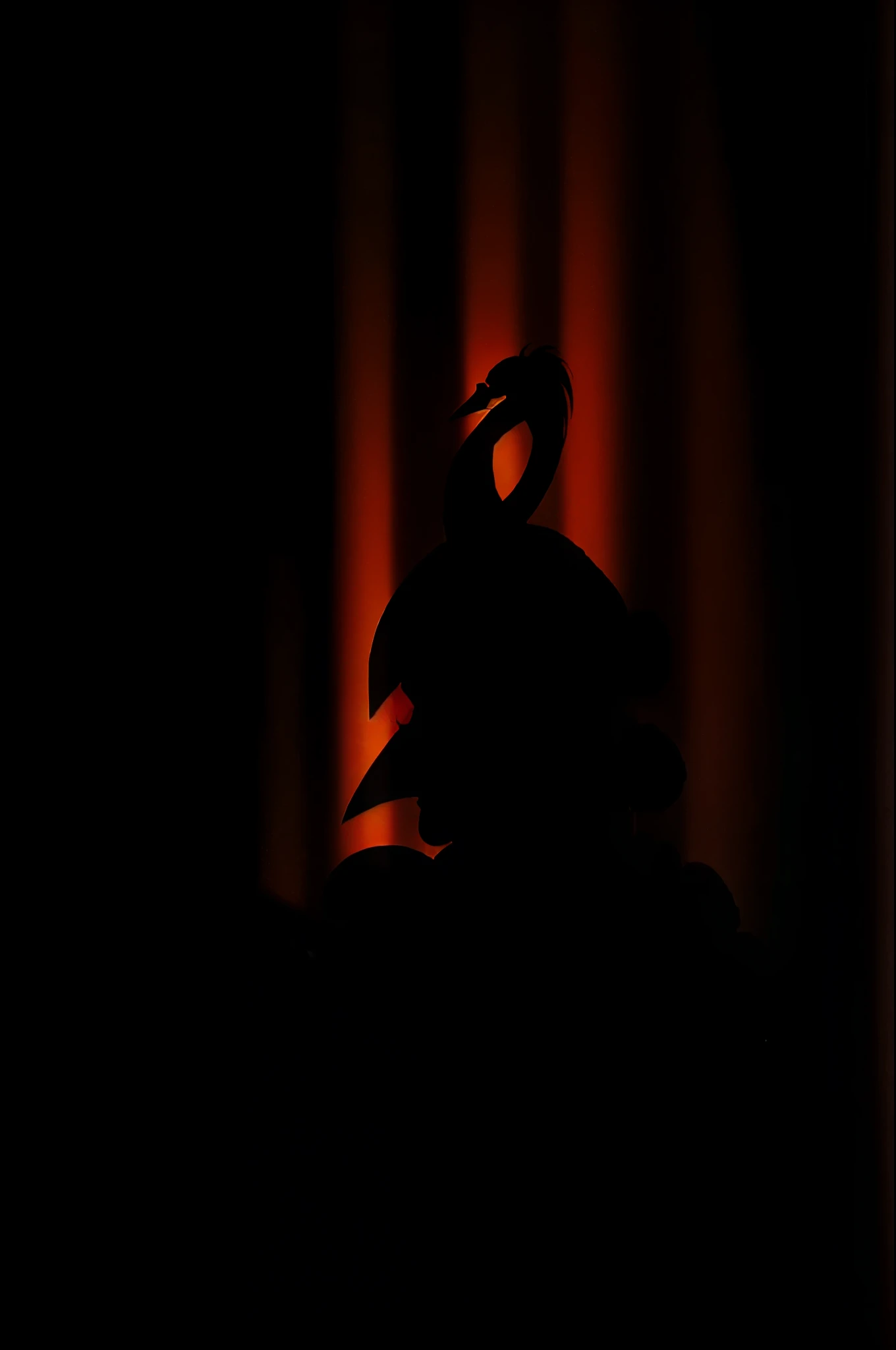 Silhouette of a swan with boxing gloves on