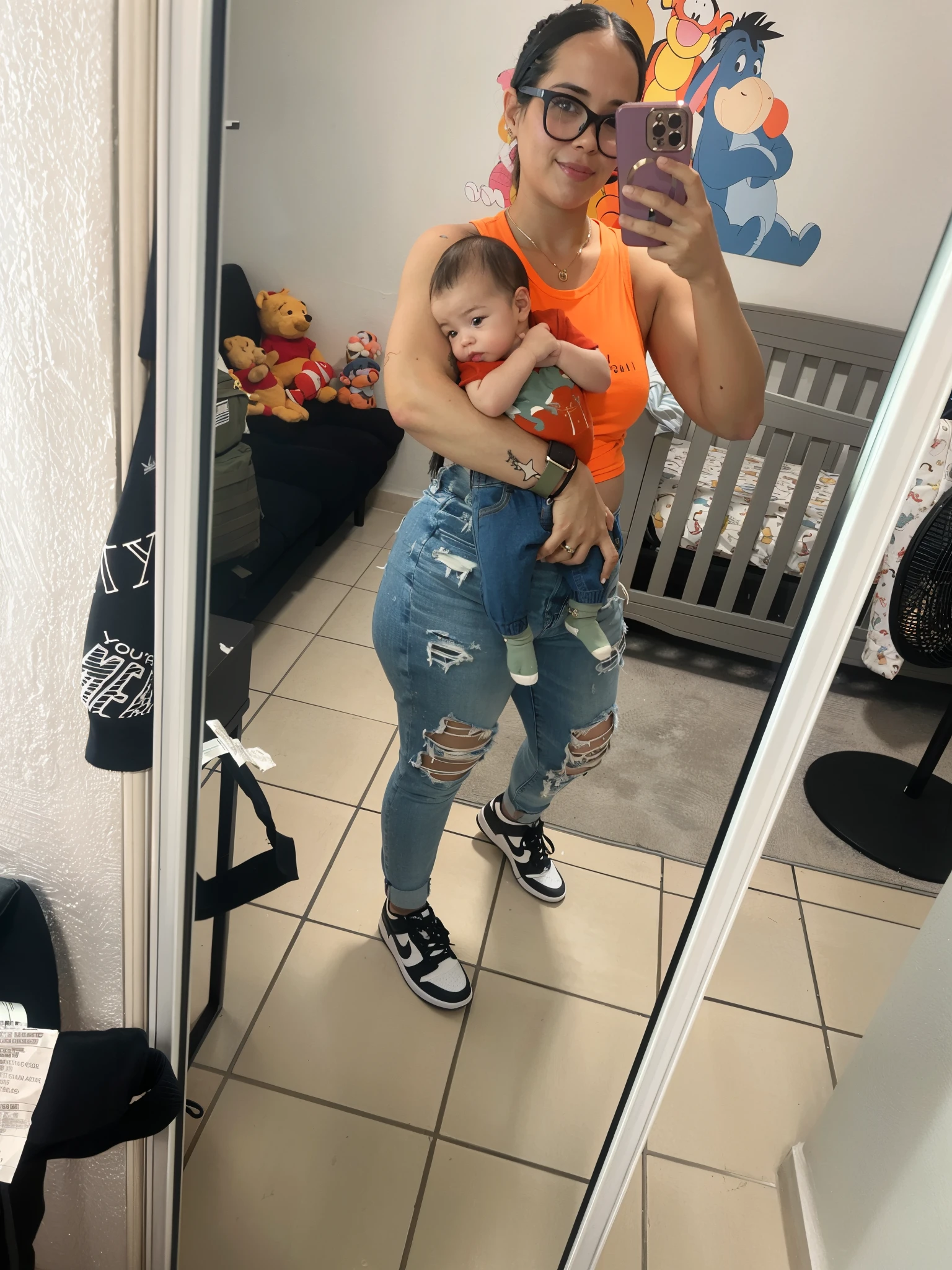 there is a woman holding a baby in her arms and taking a picture, full body picture, ripped jeans,