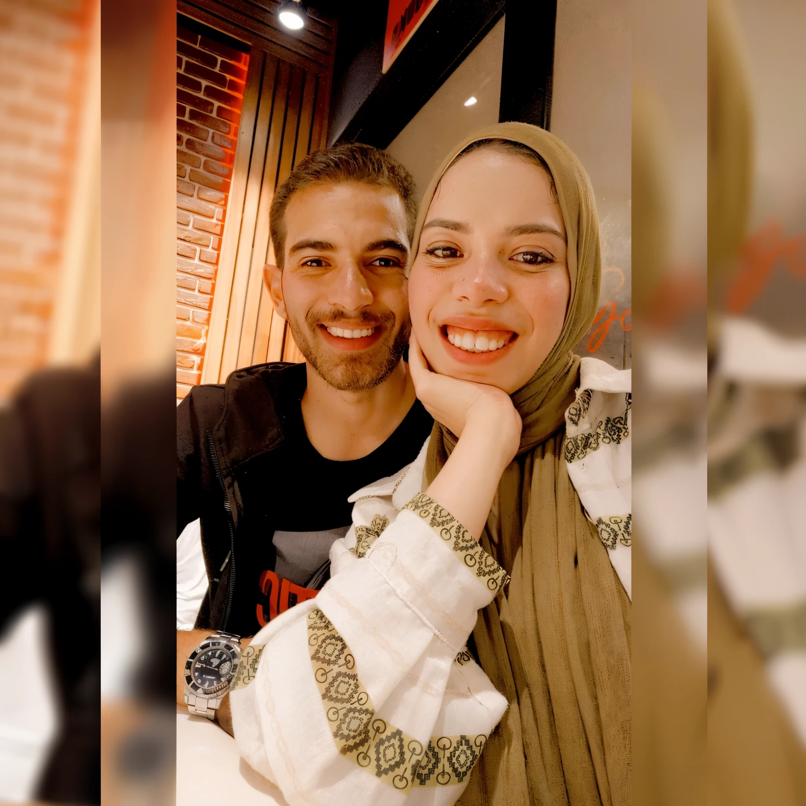 There is a man and a woman sitting at a table with a plate of food, Very, very low quality image, lovely couple, Smiling couple, Facebook post, Happy couple, Disinfectant laughs, Leaked image, Instagram Story, 8K selfie, enes dirig, They both smile for the camera, With a beautiful smile, profile pic, Snapchat image