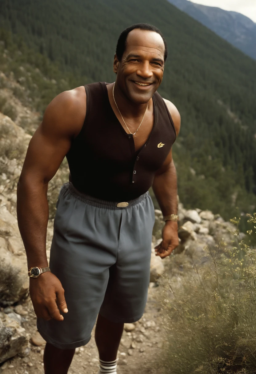 A photo of Simpson exploring a scenic hiking trail in the mountains,original,O.J. Simpson, “The Juice”, a former American football star, had a commanding athletic build, standing at 6’1” with a strong, muscular frame indicative of his years as a professional athlete. His charismatic smile and confident demeanor were recognizable features, making him a familiar and popular figure in the public eye. Simpson maintained a well-groomed appearance, often seen in tailored suits, reflecting his transition from sports to a career in entertainment.