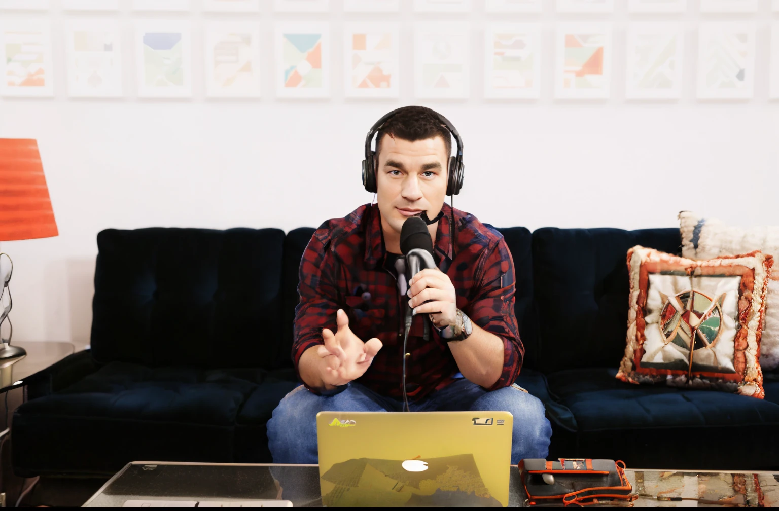 arafed man sitting on a couch with a laptop and headphones on, sitting in front of a microphone, studio shot, tyler west, holding a microphone, kyle hotz, nathan fielder, holding microphone, pete morbacher, talk show, josh grover, alex miranda, bryan sola, promo image, promo art, andrew gonzalez, adam, rick dai, in a studio