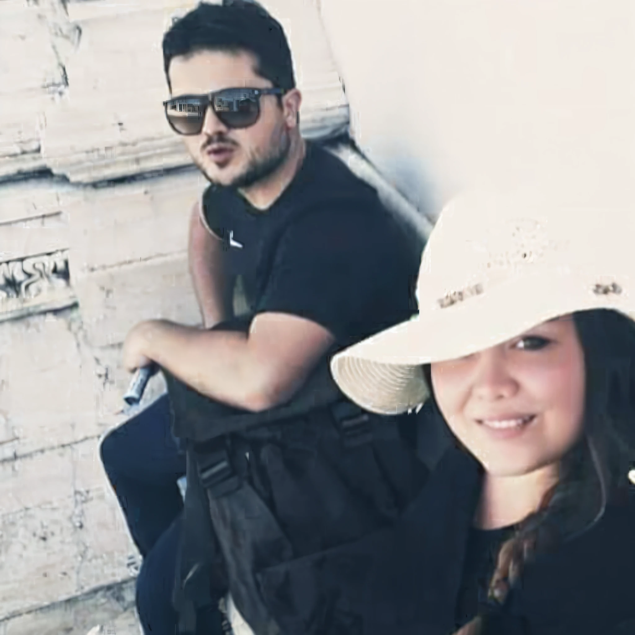 there are two people sitting on a bench with hats on, profile photo, profile image, profile pic, vacation photo, profile picture, tourists in background, colored photo, at pamukkale, lovely couple, in sunny weather, photo taken in 2 0 2 0, in the colosseum, ruins in the background, happy couple, back to us, they are very serious
