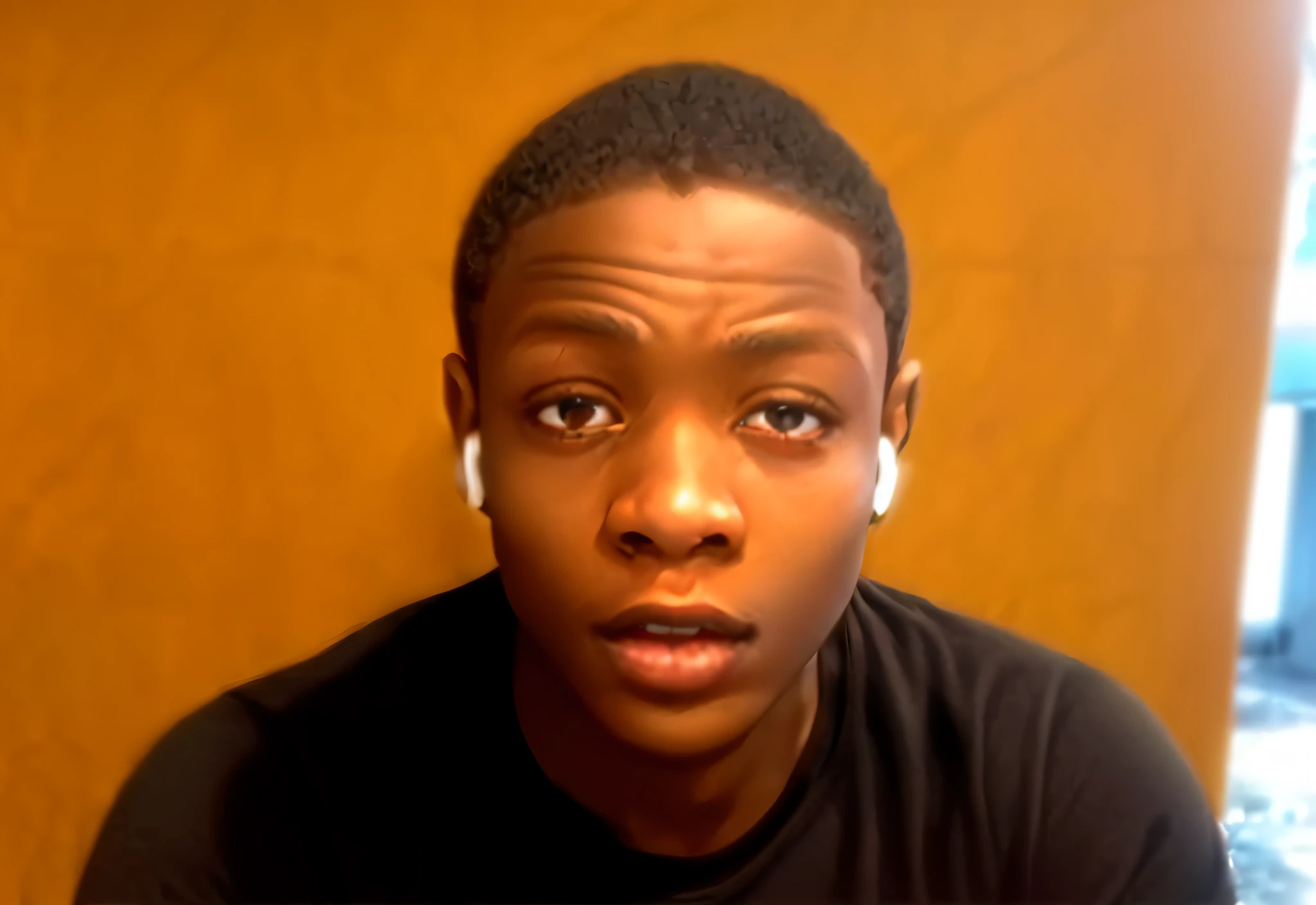 arafed man with earphones on sitting in front of a wall, tyler, black age boy, riyahd cassiem, he is about 20 years old | short, photo in style of tyler mitchell, in style of tyler mitchell, bladee from drain gang, youtube video screenshot, orisha, male teen, brandon, headshot profile picture, daniel