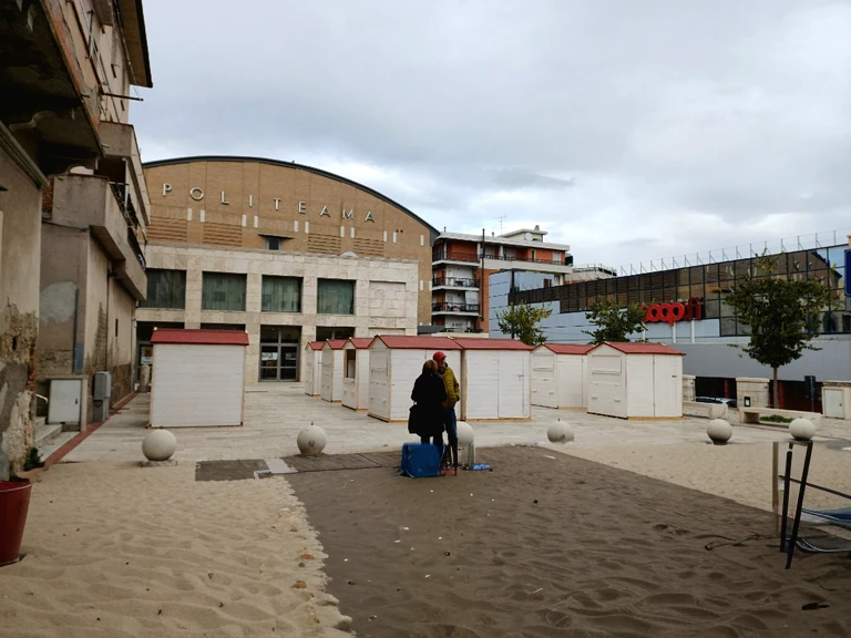 a beach with some umbrellas