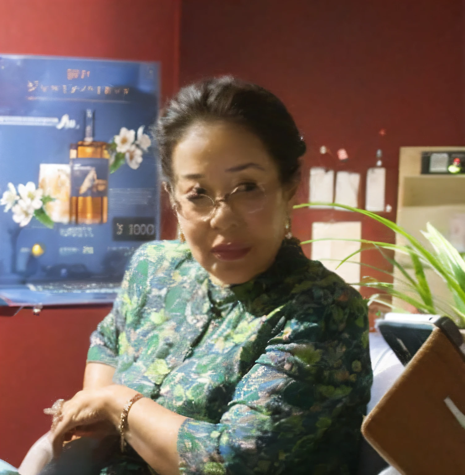 A woman sitting on a chair with a laptop and a plant on her lap,