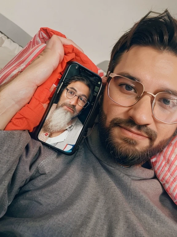 arafed man with glasses and beard laying on a bed with a cell phone, in love selfie, 8k selfie photograph, iphone selfie, tiktok video, very very low quality picture, portait photo profile picture, profile pic, selfie of a girl, facebook post, in the background, instagram story, mkbhd, 😭🤮 💔, profile photo